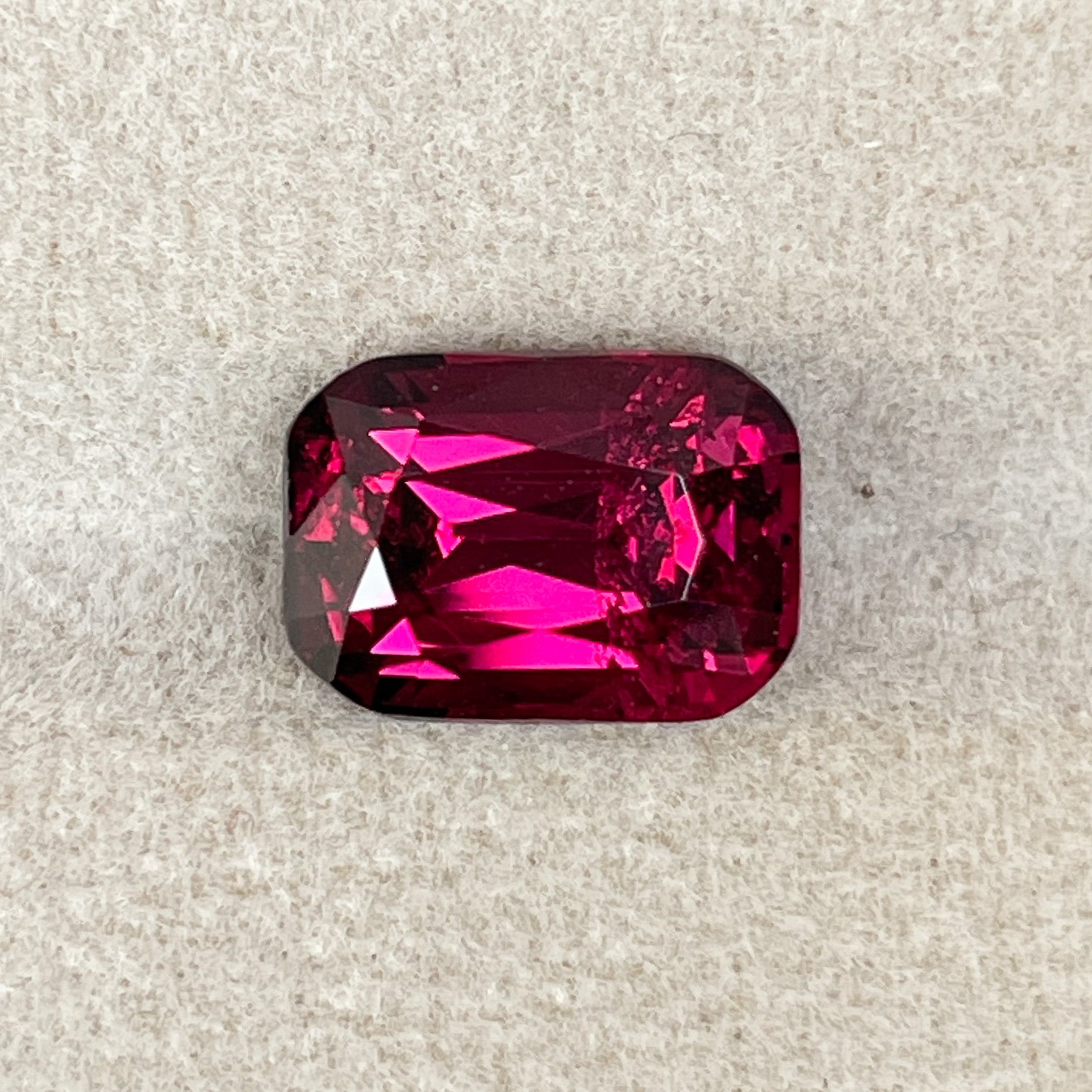 Natural Rhodolite Garnet 5 Ct cushion cut loose gemstone in raspberry red, ideal for engagement rings by NASHGEMS.
