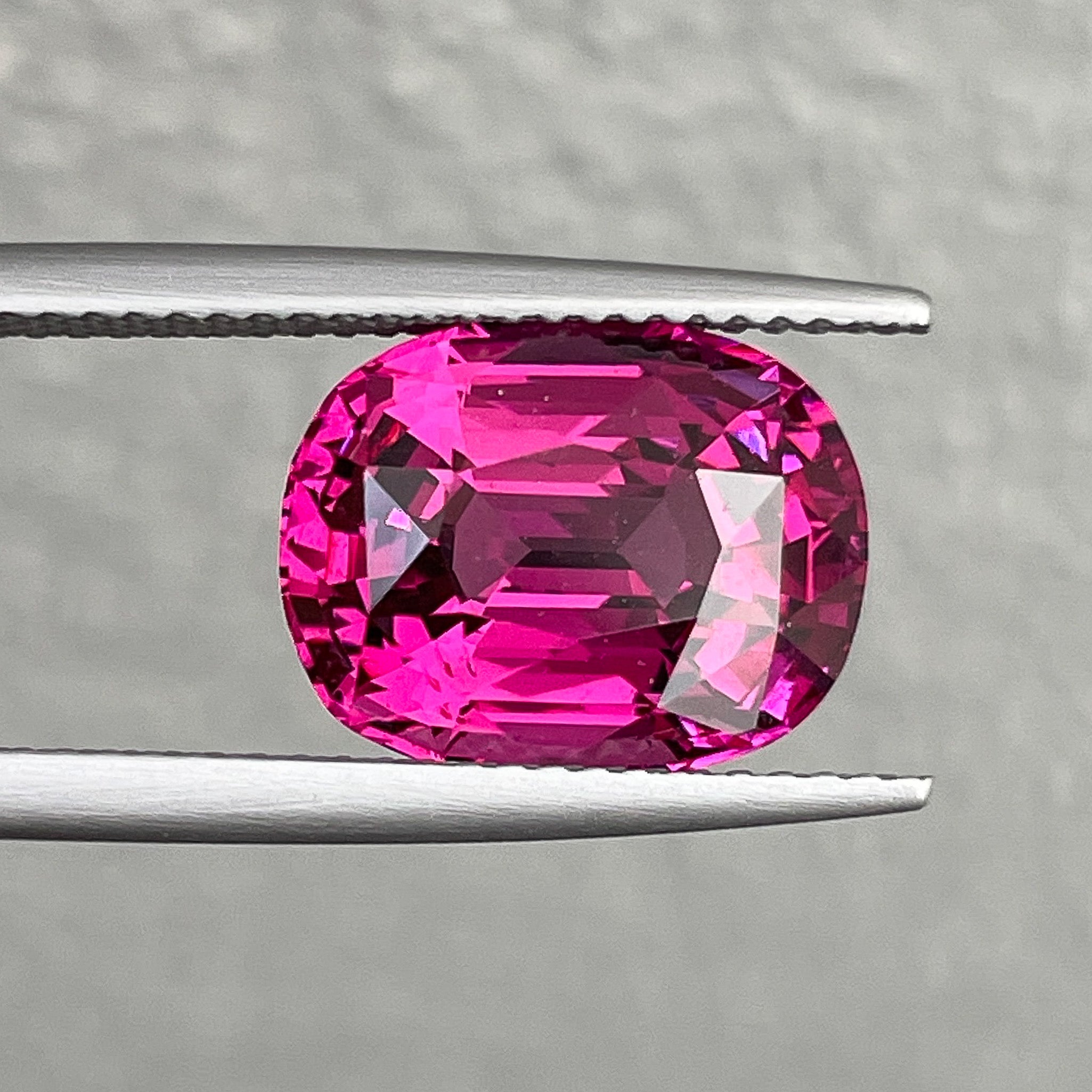 Oval cut Natural Rhodolite Garnet 7.07 Ct from NASHGEMS, vibrant raspberry red VVS loose gemstone for engagement rings.
