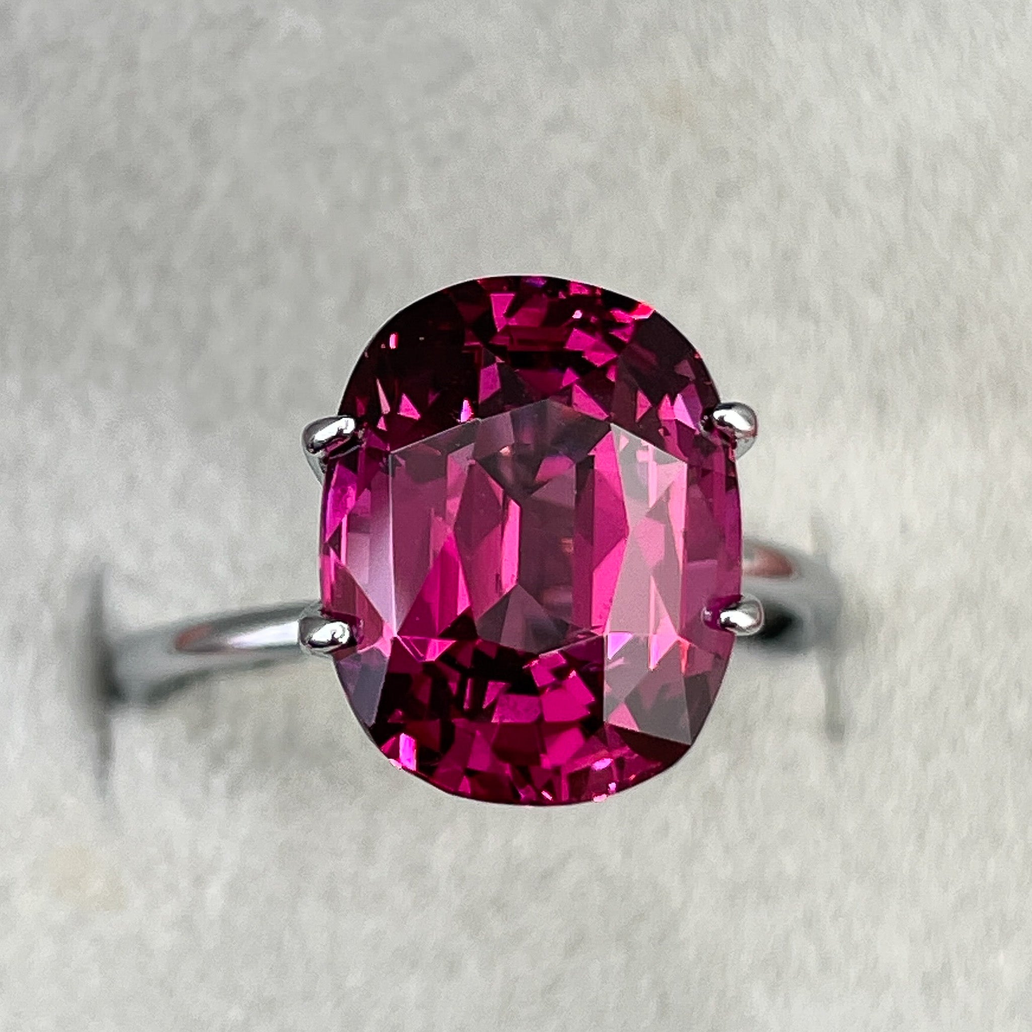 Oval-shaped natural Rhodolite Garnet, 7.07 Ct, raspberry red VVS loose gemstone for engagement rings by NASHGEMS.