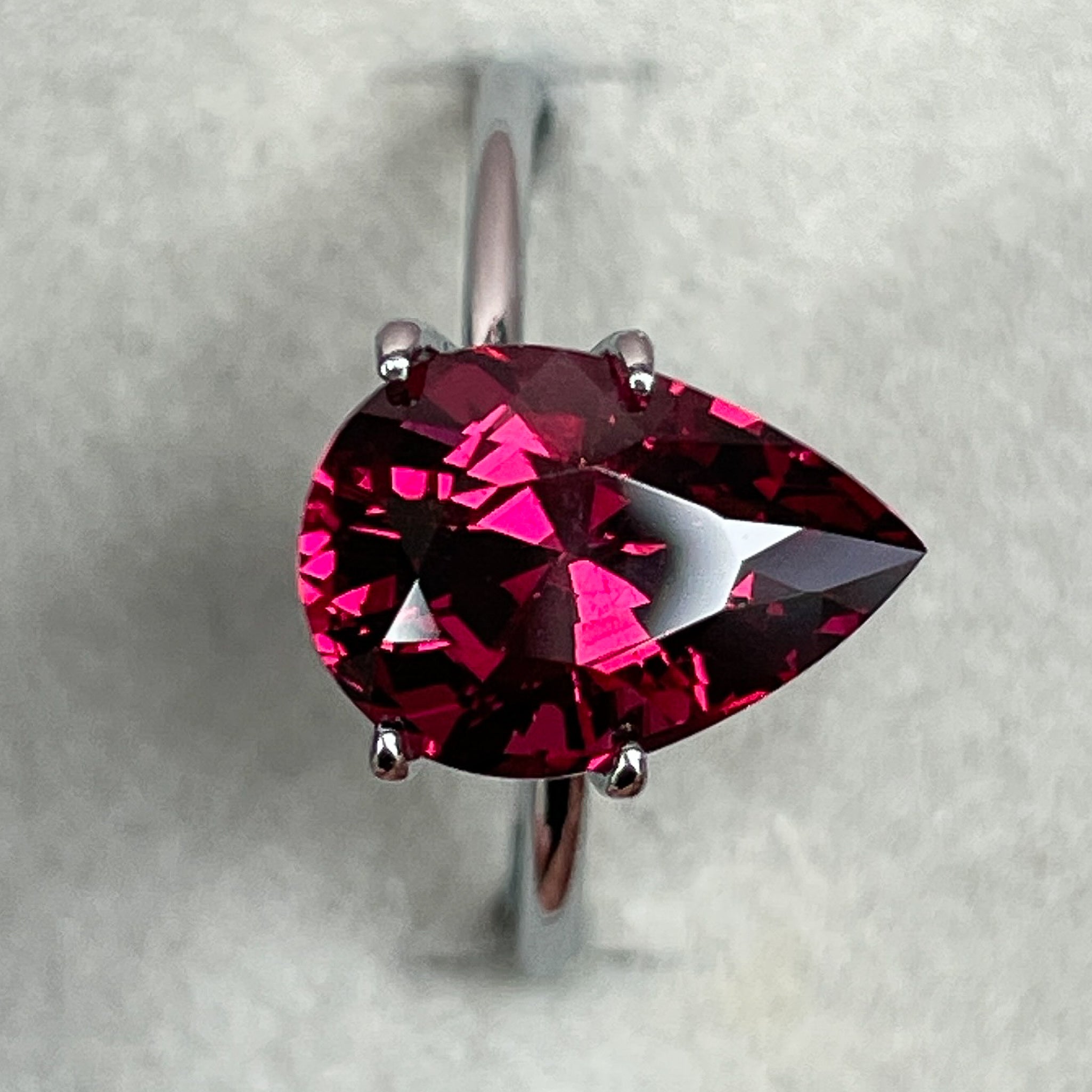 Natural Rhodolite Garnet 4.33 Ct pear-shaped loose gemstone in raspberry red for engagement rings, from NASHGEMS.
