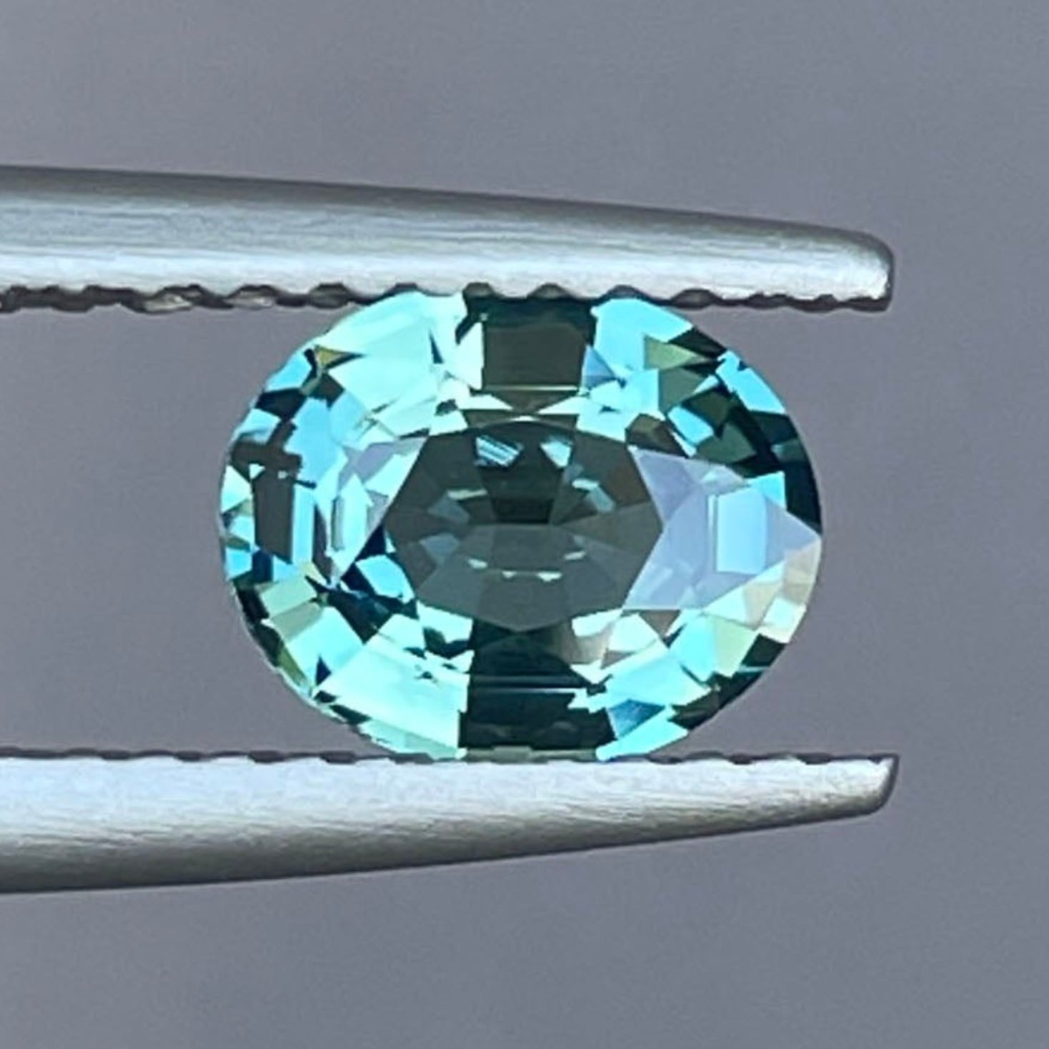 Natural teal blue green sapphire oval cut 1.20 ct. heat-treated loose gemstone for custom rings, engagement rings, or pendants.