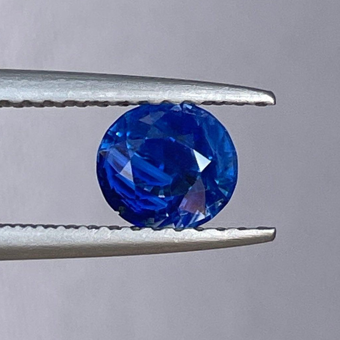 Natural blue sapphire Neelam birthstone gemstone, 0.97 carats, in a NASHGEMS ring, showcasing a vibrant blue sapphire for women jewelry.