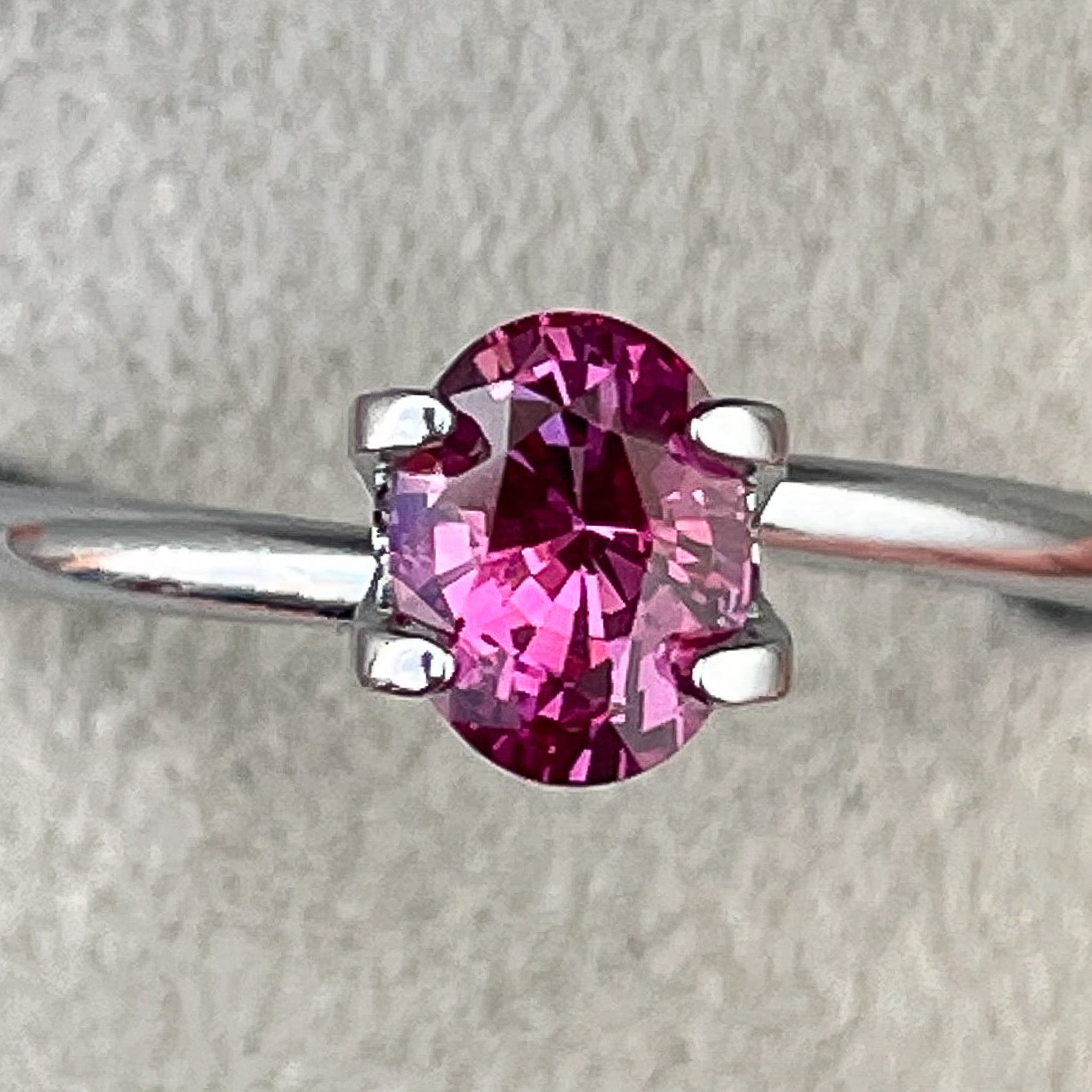 Natural pink sapphire loose gemstone, 1.00 carat oval cut by NASHGEMS, heat-treated pink sapphire for jewelry or engagement rings.