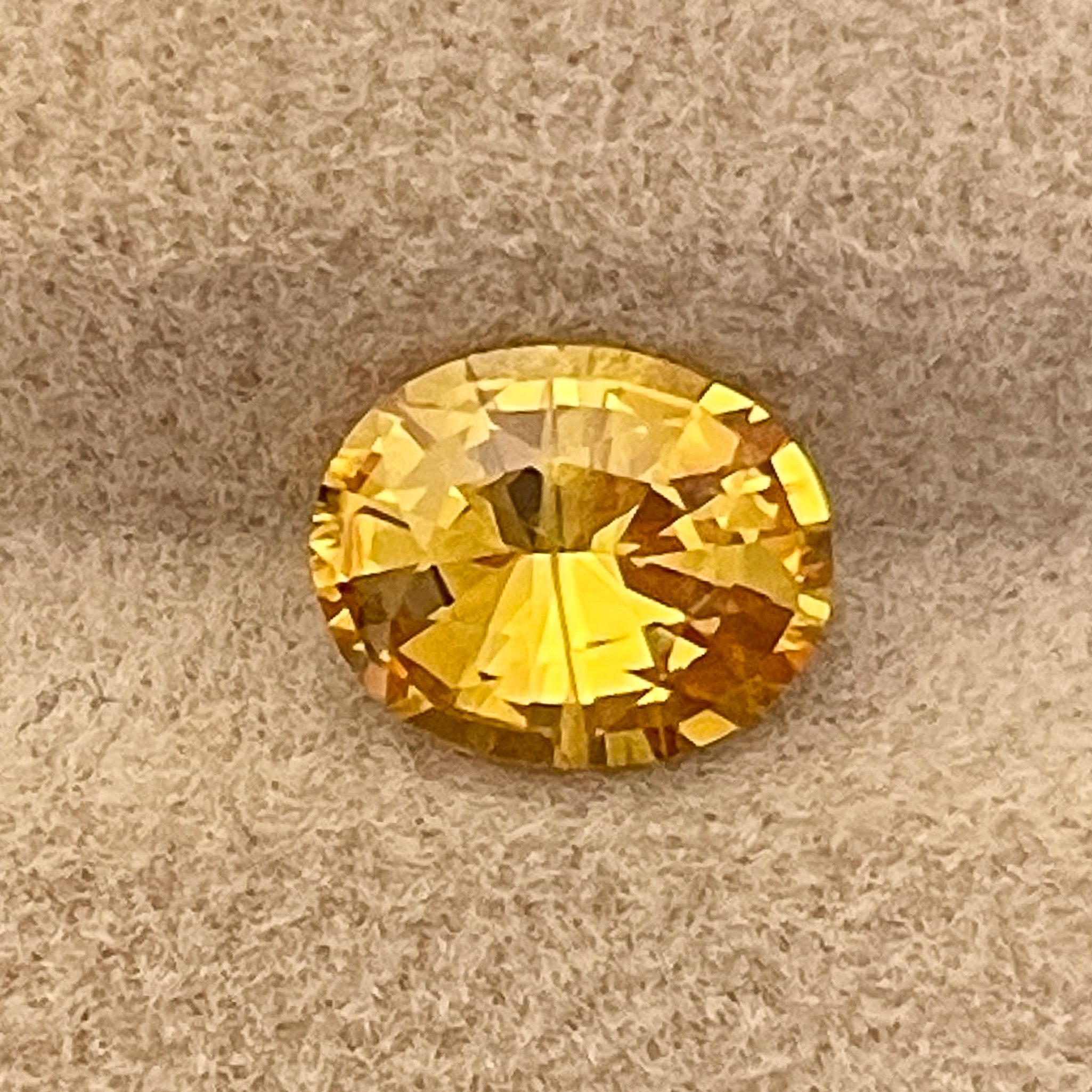 Natural yellow sapphire gemstone, 1.27 carats, oval cut, heat-treated loose yellow sapphire by NASHGEMS for jewelry crafting.