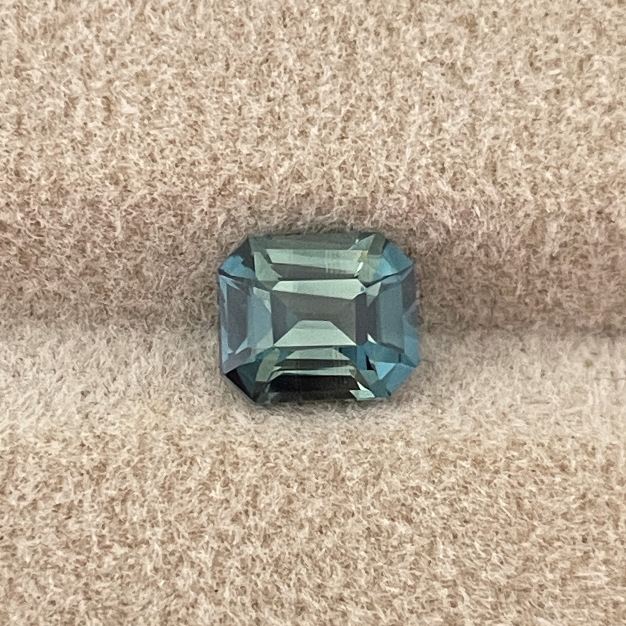 Natural teal blue-green bi-color sapphire, 1.38 Ct emerald cut, loose no-heat sapphire for engagement rings by NASHGEMS.