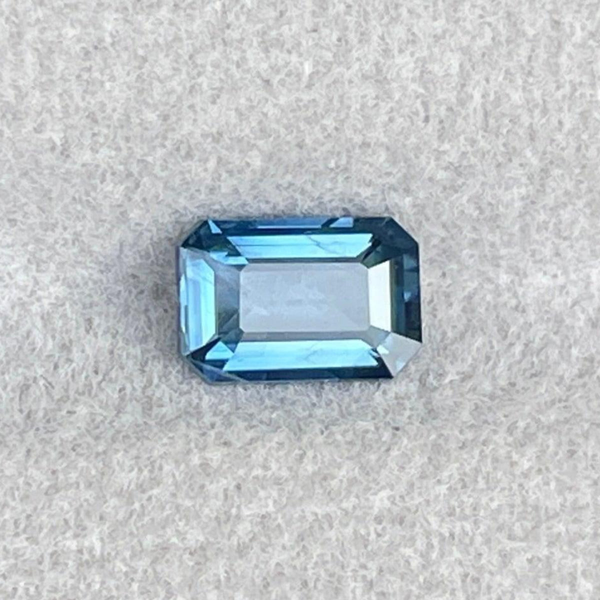 Teal sapphire precious stone with emerald cut, 1.11 Crt, for September birthstone, suitable for engagement rings and jewelry.
