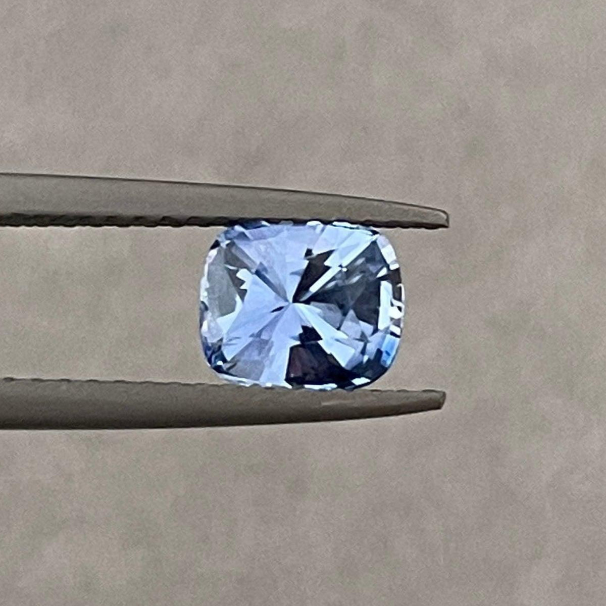 Blue sapphire jewelry including a 1.17 carat sapphire wedding band, pendant necklace, and engagement ring by NASHGEMS.