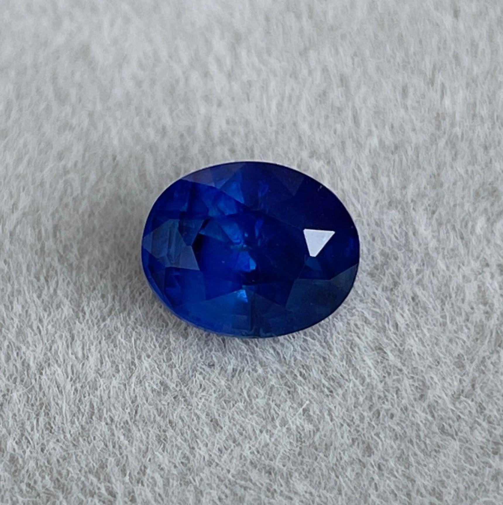 Natural blue sapphire gemstone, 1.67 ct, from NASHGEMS, set in a ring, perfect as a birthstone or engagement ring.