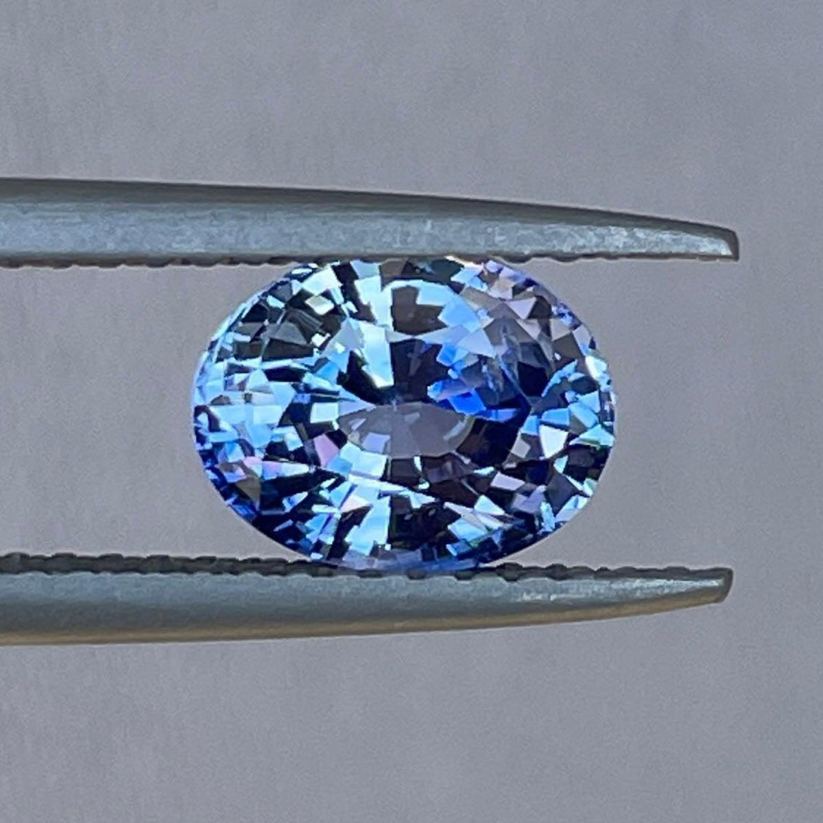 Blue sapphire jewelry including a 1.53 ct natural sapphire wedding band, pendant necklace, and engagement ring from NASHGEMS.