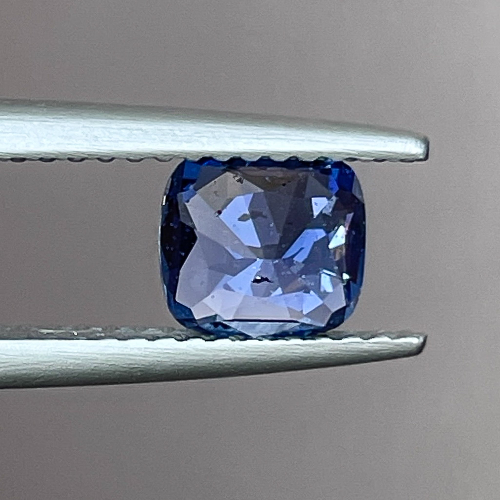 Natural Ceylon Blue Sapphire 1.06 Ct cushion cut loose gemstone by NASHGEMS, showcasing vibrant blue color and elegant shape.