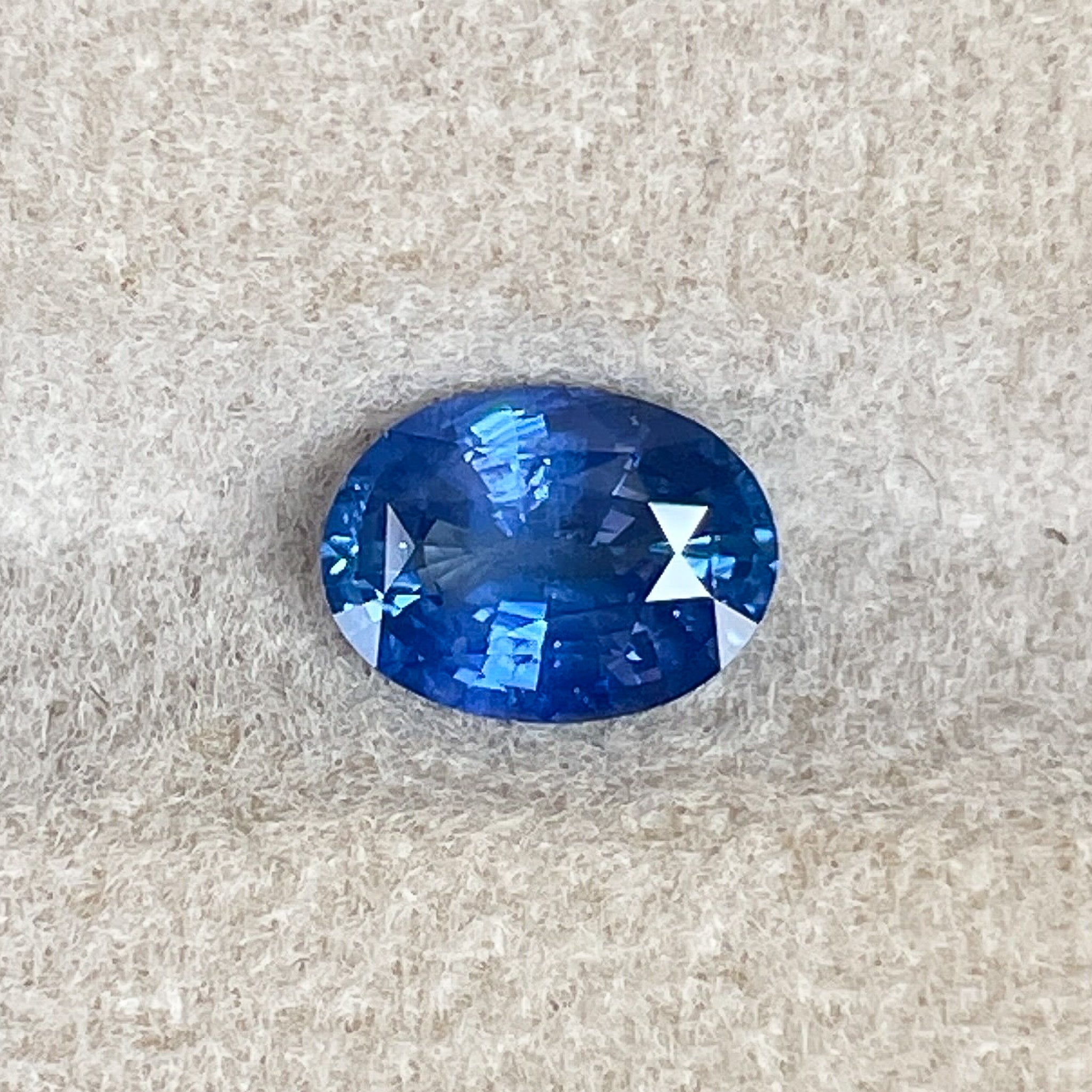 Natural Ceylon Blue Sapphire 0.97 Ct oval cut, loose gemstone by NASHGEMS, ideal for engagement rings or jewelry crafting.