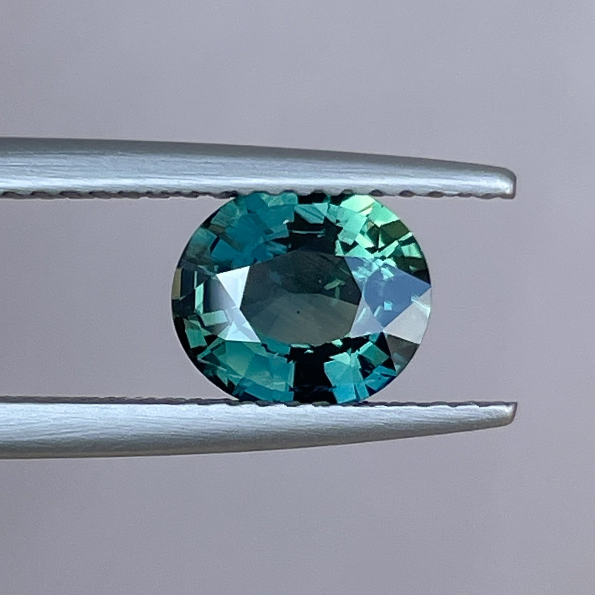 Natural forest green sapphire, 1.56 Ct oval cut loose teal sapphire from NASHGEMS for engagement or custom jewelry design.