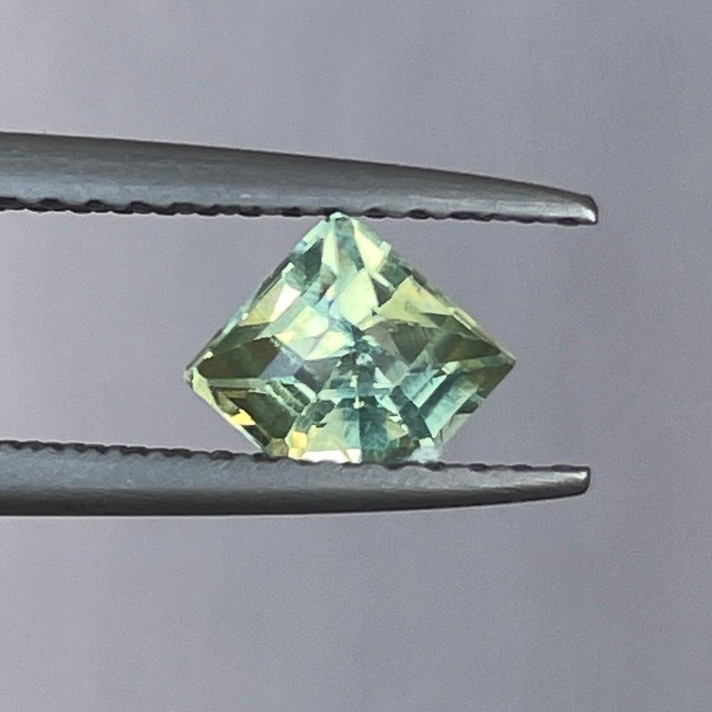 Teal green loose sapphire gemstone from NASHGEMS, 0.72 carats, ideal for rings or pendants, September birthstone jewelry.