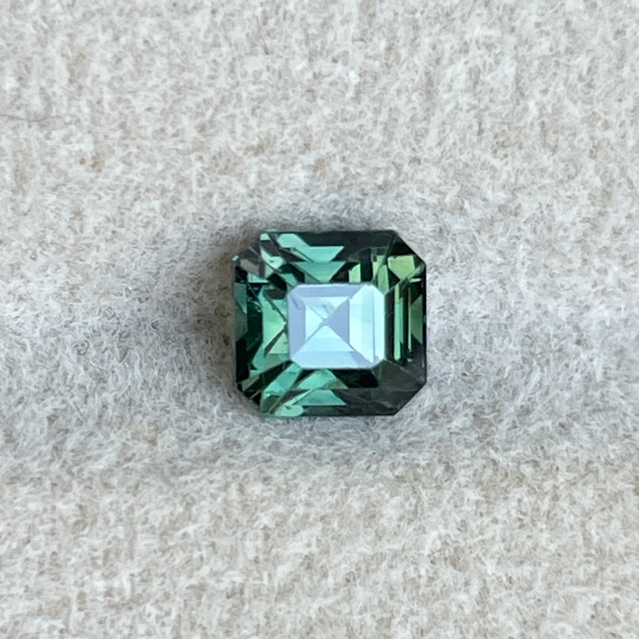 Teal natural forest green sapphire loose gemstone, 1.09 Ct emerald cut by NASHGEMS, ideal for engagement or custom jewelry.