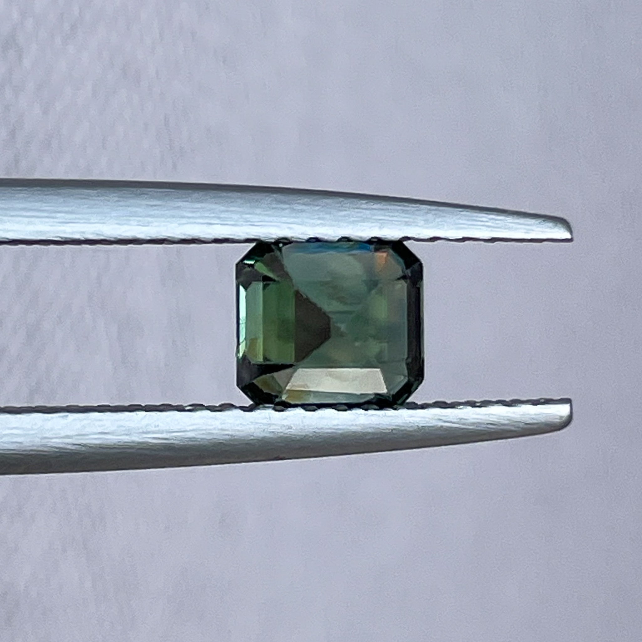 Natural forest green sapphire 1.09 Ct emerald cut loose gemstone by NASHGEMS, ideal for engagement rings or custom jewelry.