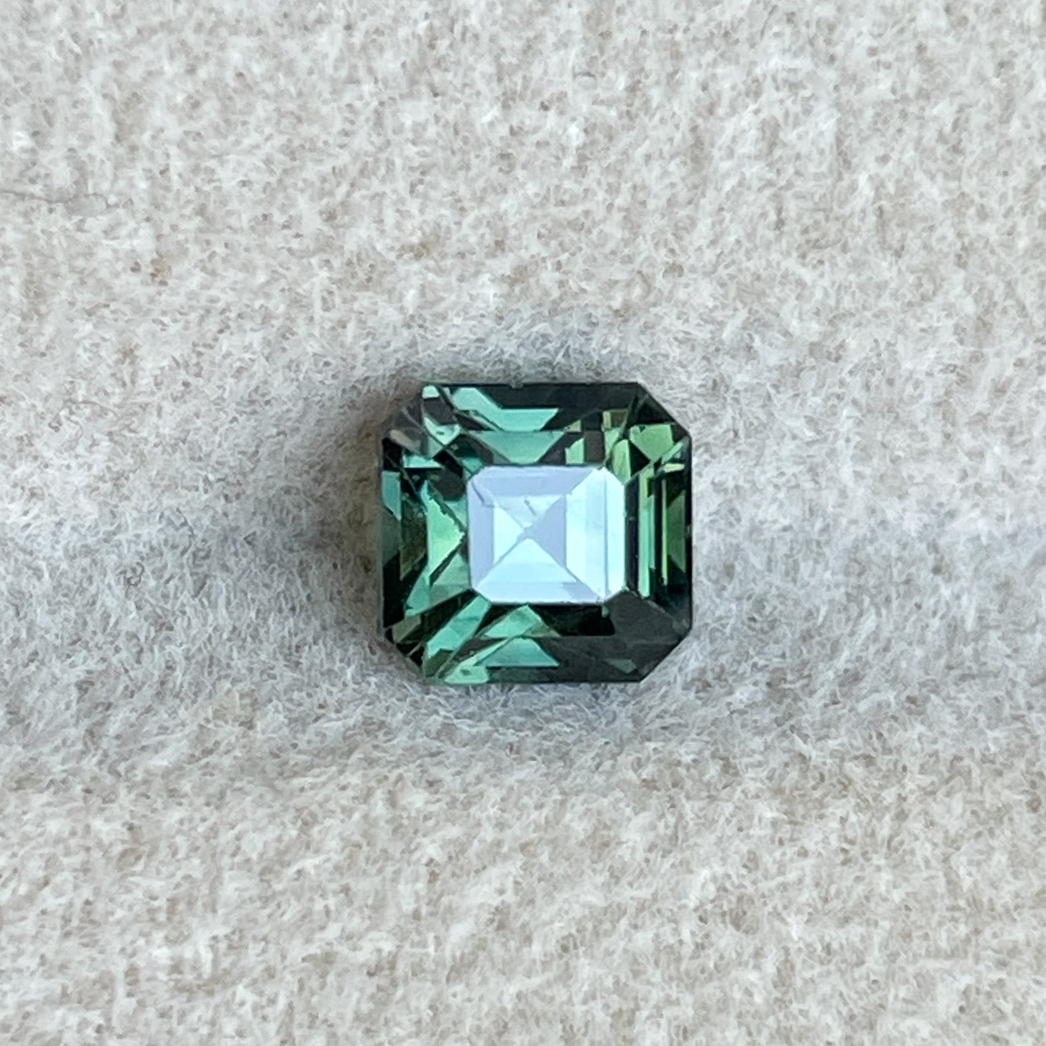 Teal natural forest green sapphire loose stone, 1.09 Ct emerald cut by NASHGEMS, ideal for engagement rings or custom jewelry.