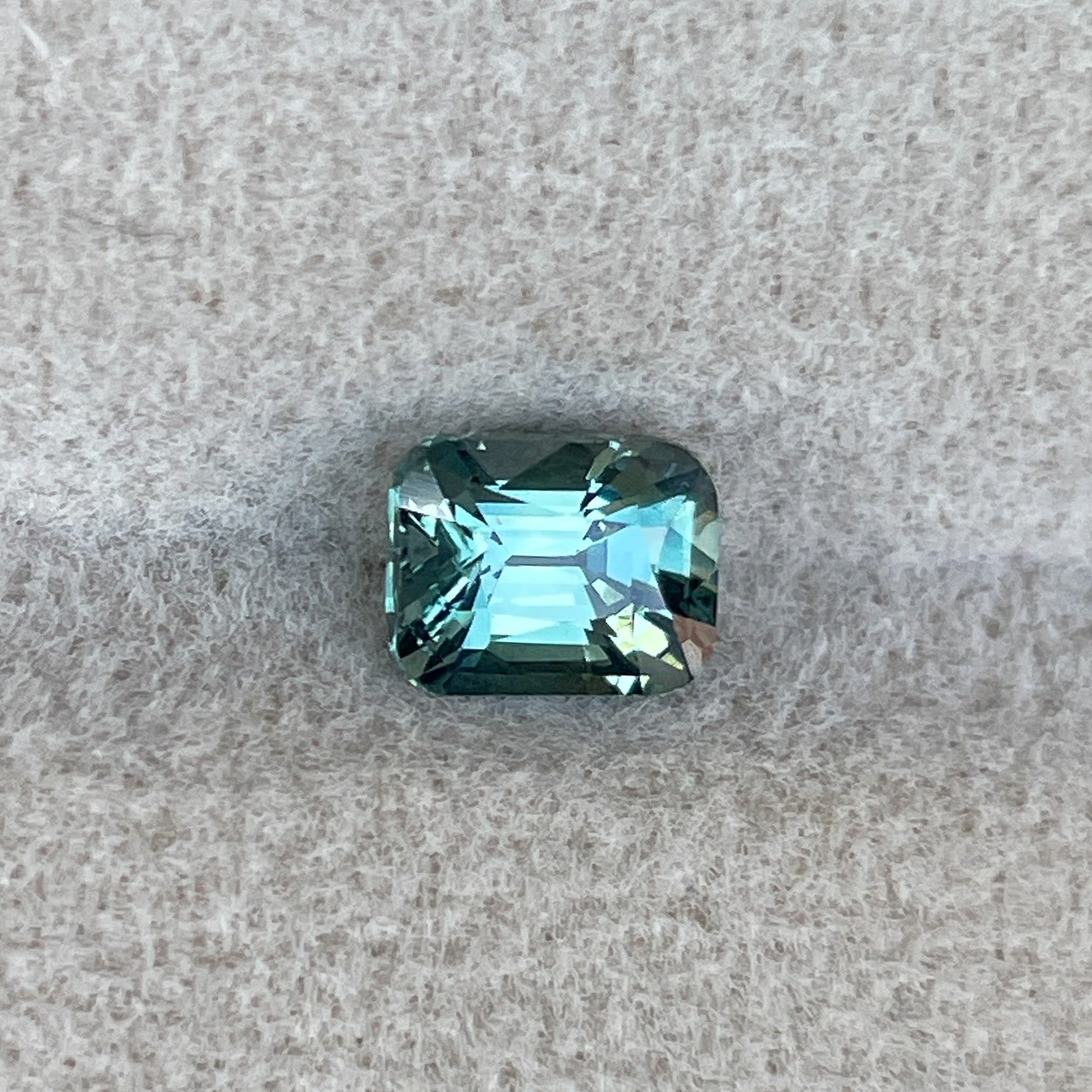 Natural teal green sapphire 1.11 Ct cushion cut loose gemstone by NASHGEMS, ideal for engagement rings or custom jewelry.