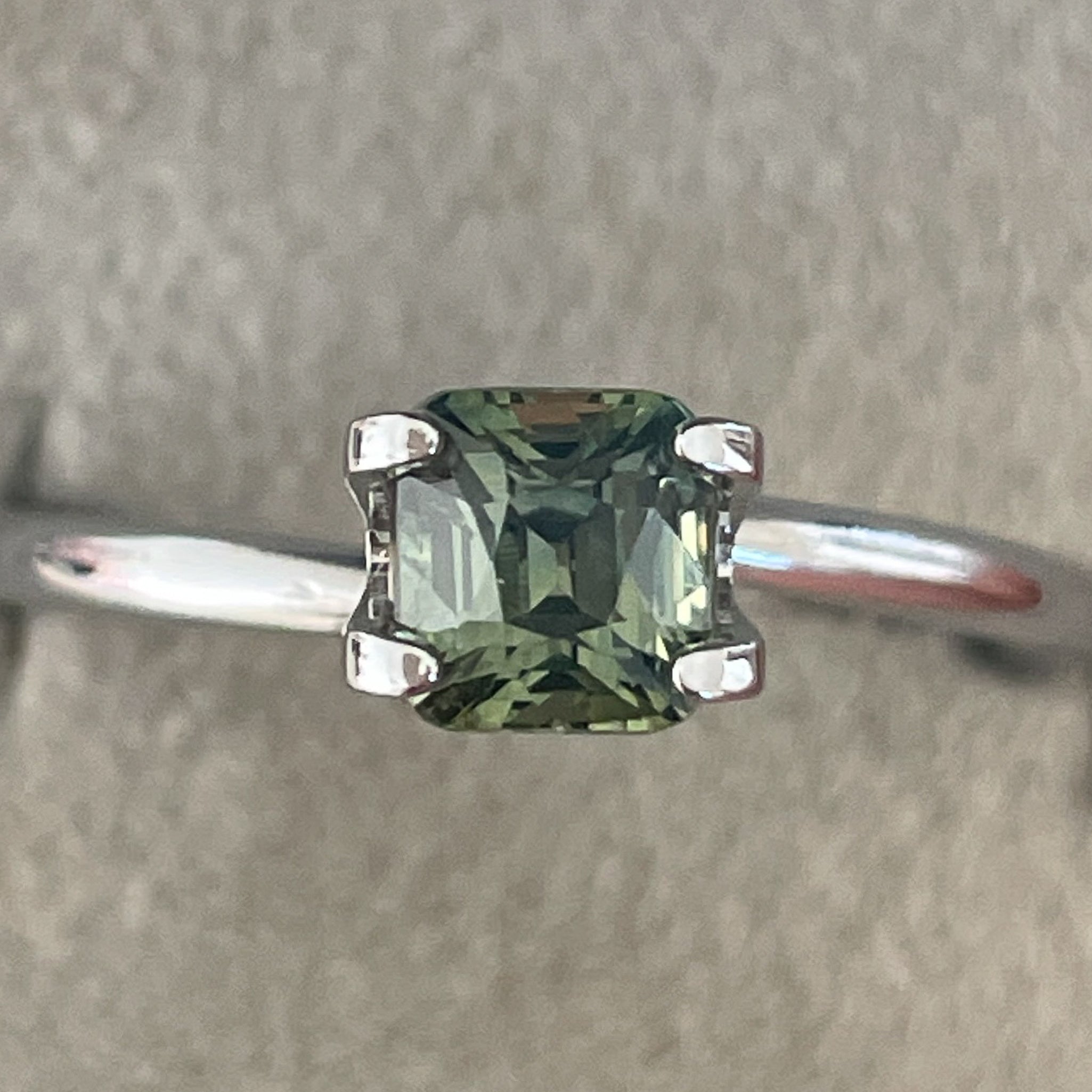 Natural pale green teal sapphire, 1.06 Ct cushion cut loose gemstone by NASHGEMS, ideal for engagement rings or custom jewelry.
