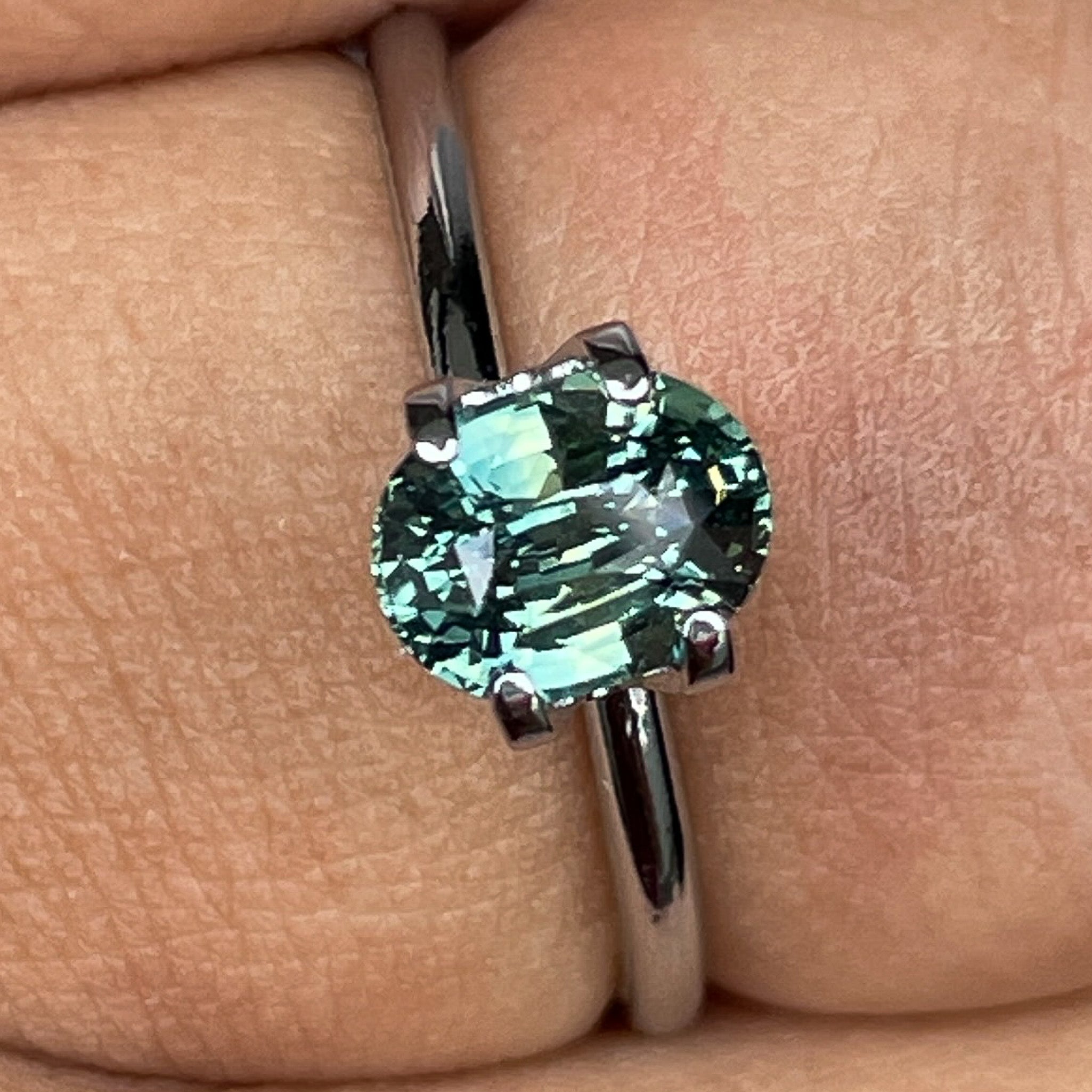 Natural teal green sapphire by NASHGEMS, 1.45 Ct oval cut loose sapphire for engagement or custom jewelry.