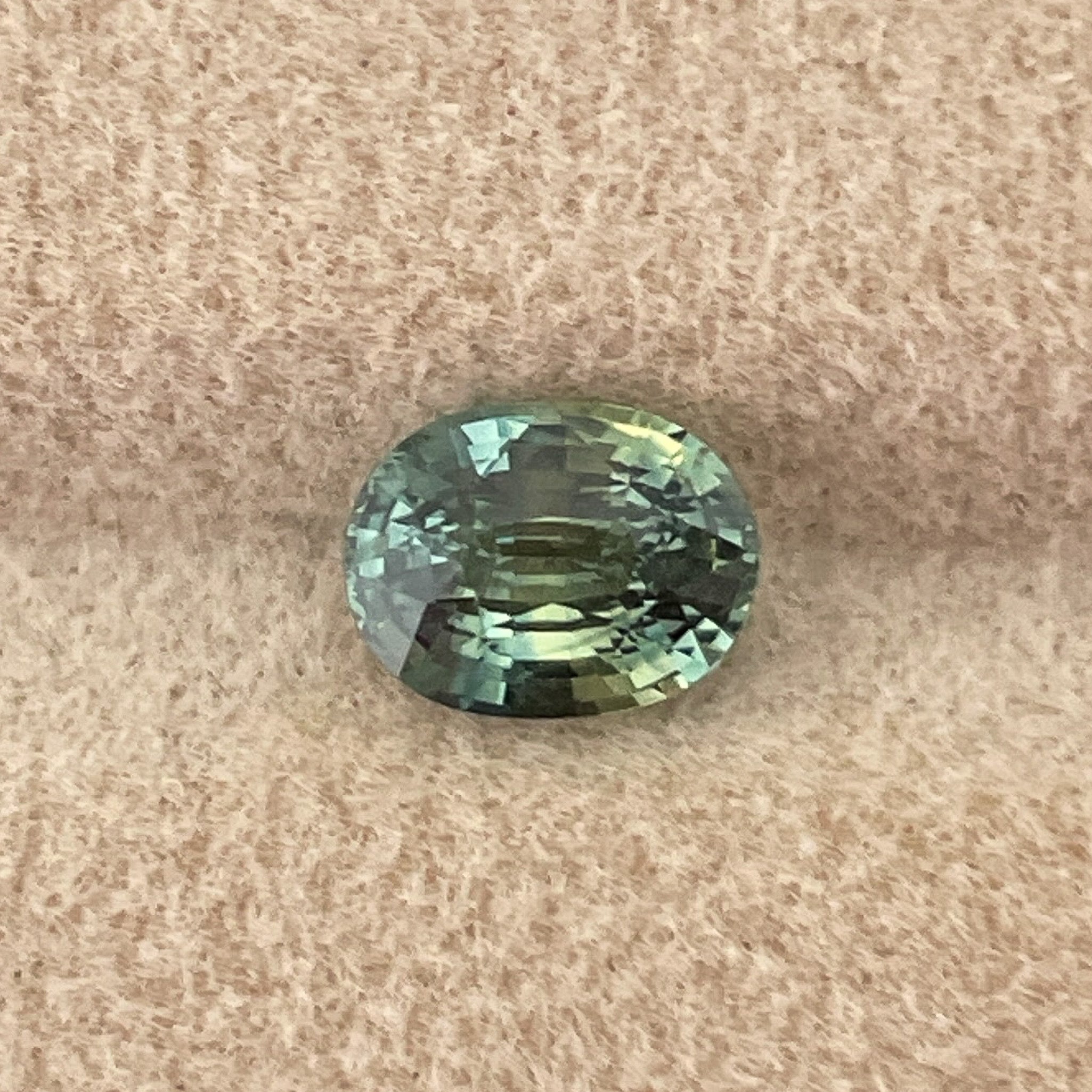 Natural teal green sapphire, 1.45 Ct oval cut loose gemstone by NASHGEMS, ideal for engagement rings or custom jewelry.