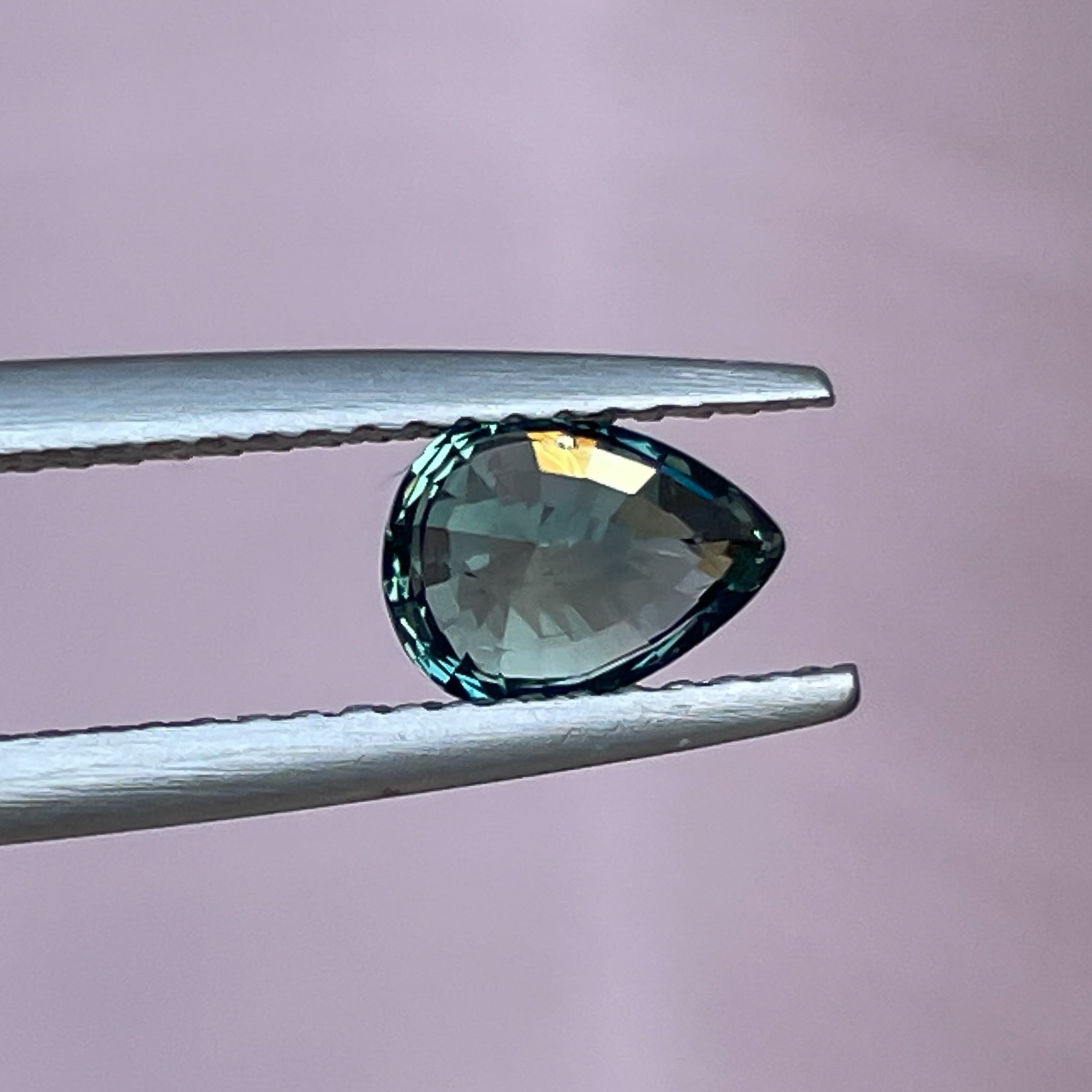 Natural NASHGEMS teal sapphire loose gemstone, 1.09 Ct pear shape, heated sapphire for jewelry or pendant creation.