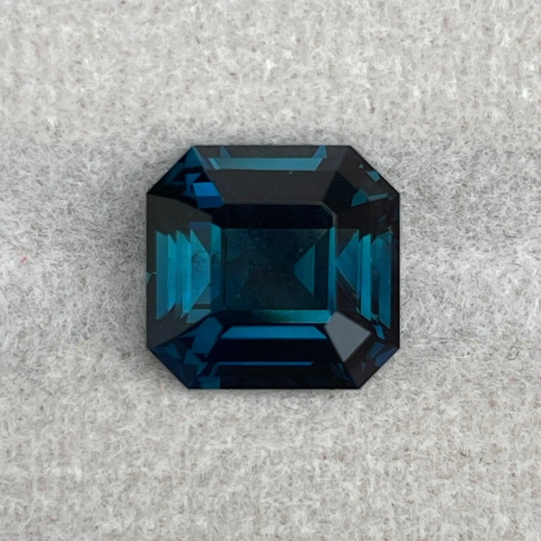 Loose teal sapphire gemstone, radiant cut, 3.50 carats, vibrant teal color similar to Montana Yogo sapphires by NASHGEMS.