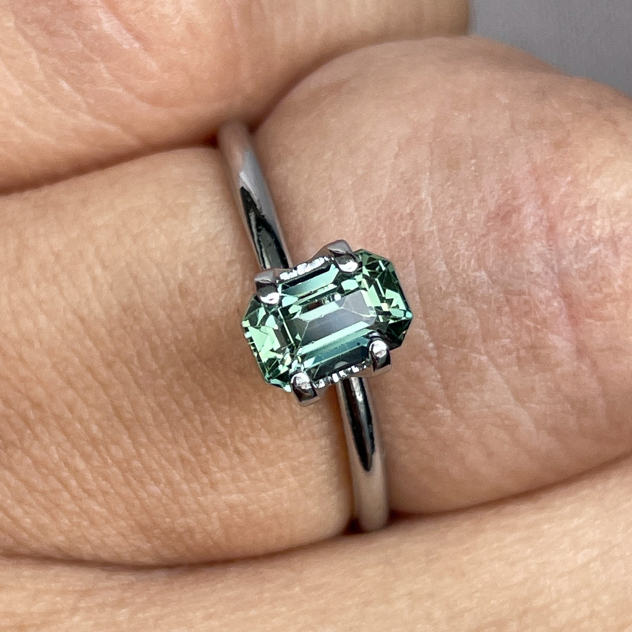 Natural pale green teal sapphire, 1.24 Ct emerald cut by NASHGEMS, loose gemstone for engagement or custom jewelry.