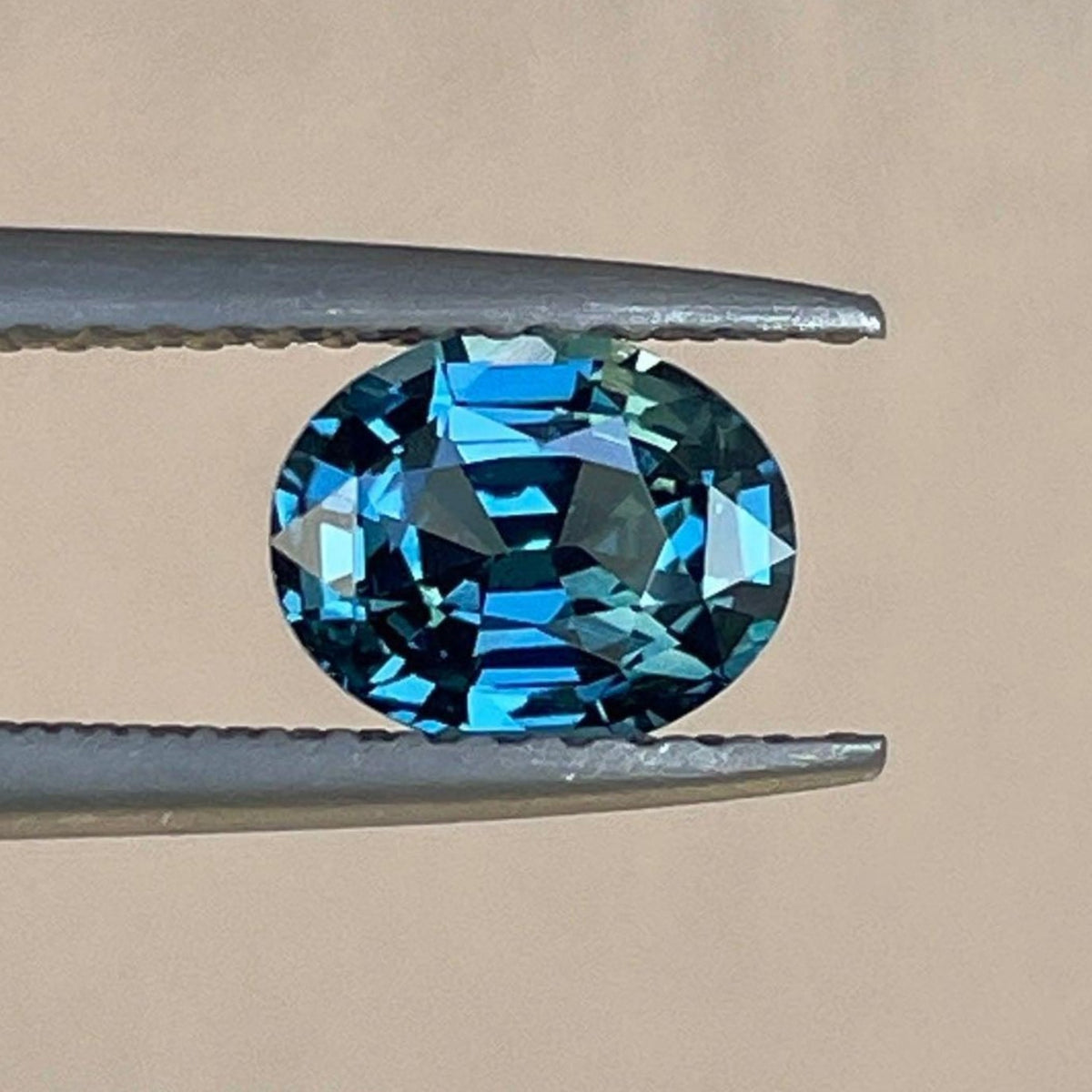 Natural blue-green sapphire oval cut 1.12 ct pendant featuring a teal sapphire gemstone, perfect for custom engagement jewelry.
