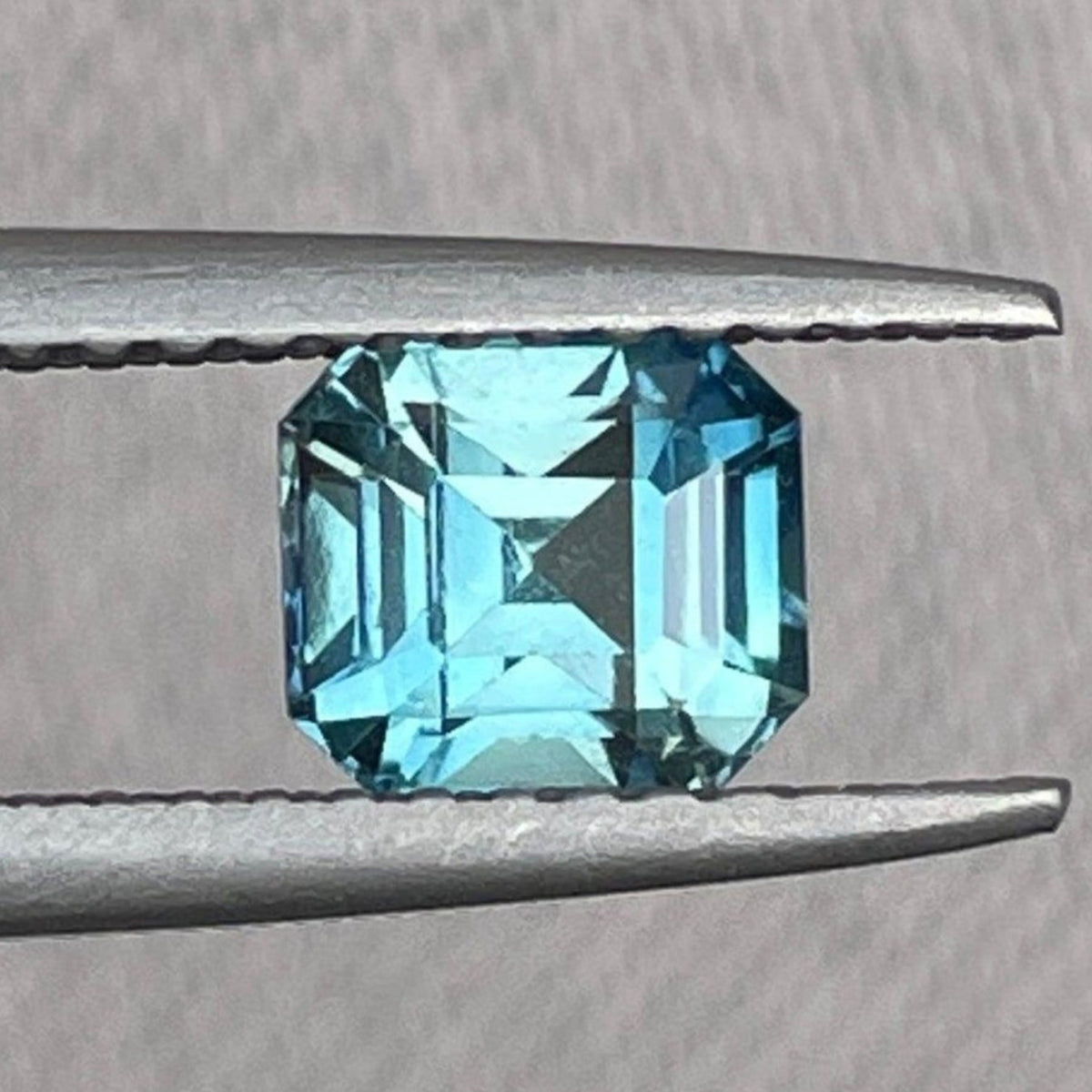 Teal sapphire birthstone pendant with emerald cut, 1.08 carats, featuring natural blue-green sapphire from NASHGEMS.