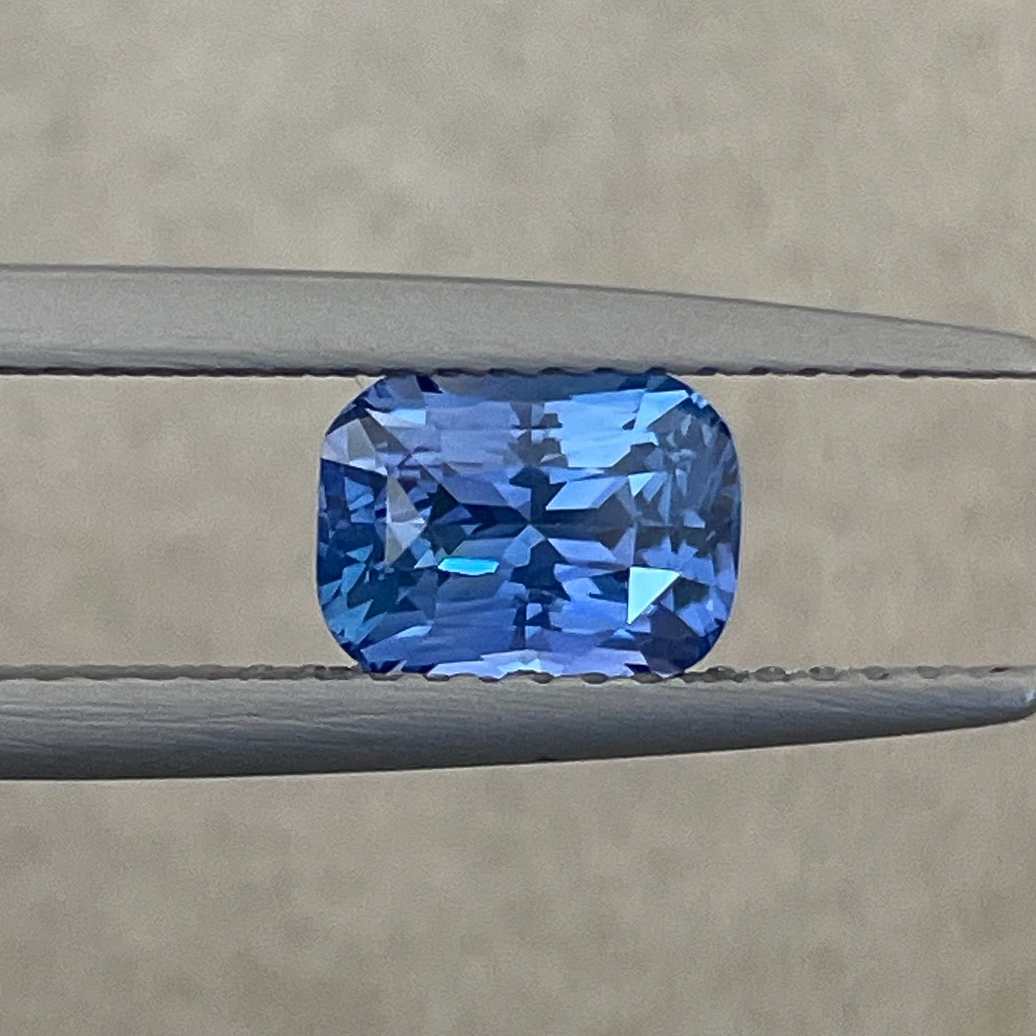 Natural Ceylon Blue Sapphire 1.60 Ct cushion cut, vivid blue loose gemstone by NASHGEMS for engagement or custom jewelry.