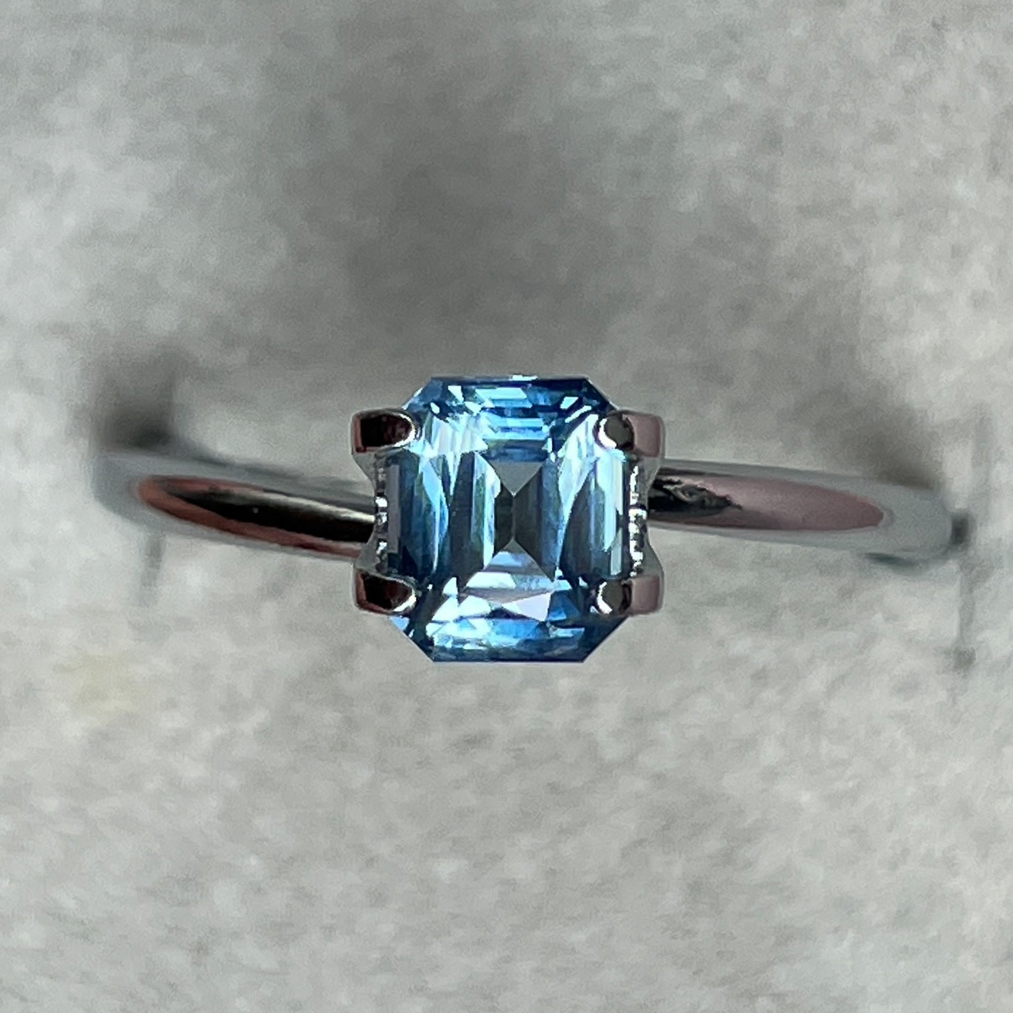 Natural pale blue teal sapphire, 1.08 Ct emerald cut, loose gemstone by NASHGEMS, ideal for engagement rings or custom jewelry.