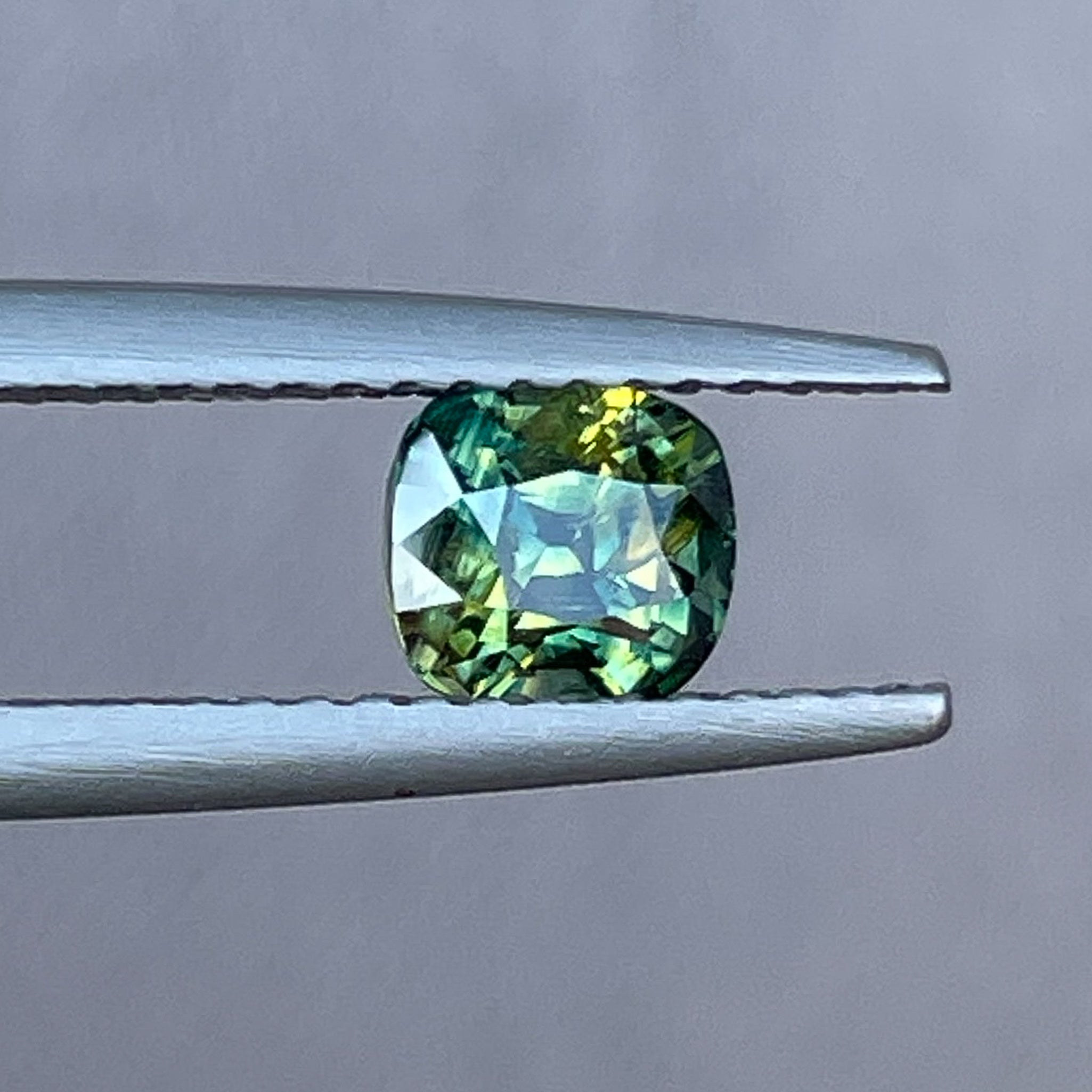 Teal Australian Parti Sapphire 1.10 Ct cushion cut loose gemstone by NASHGEMS, ideal for engagement rings or custom jewelry.