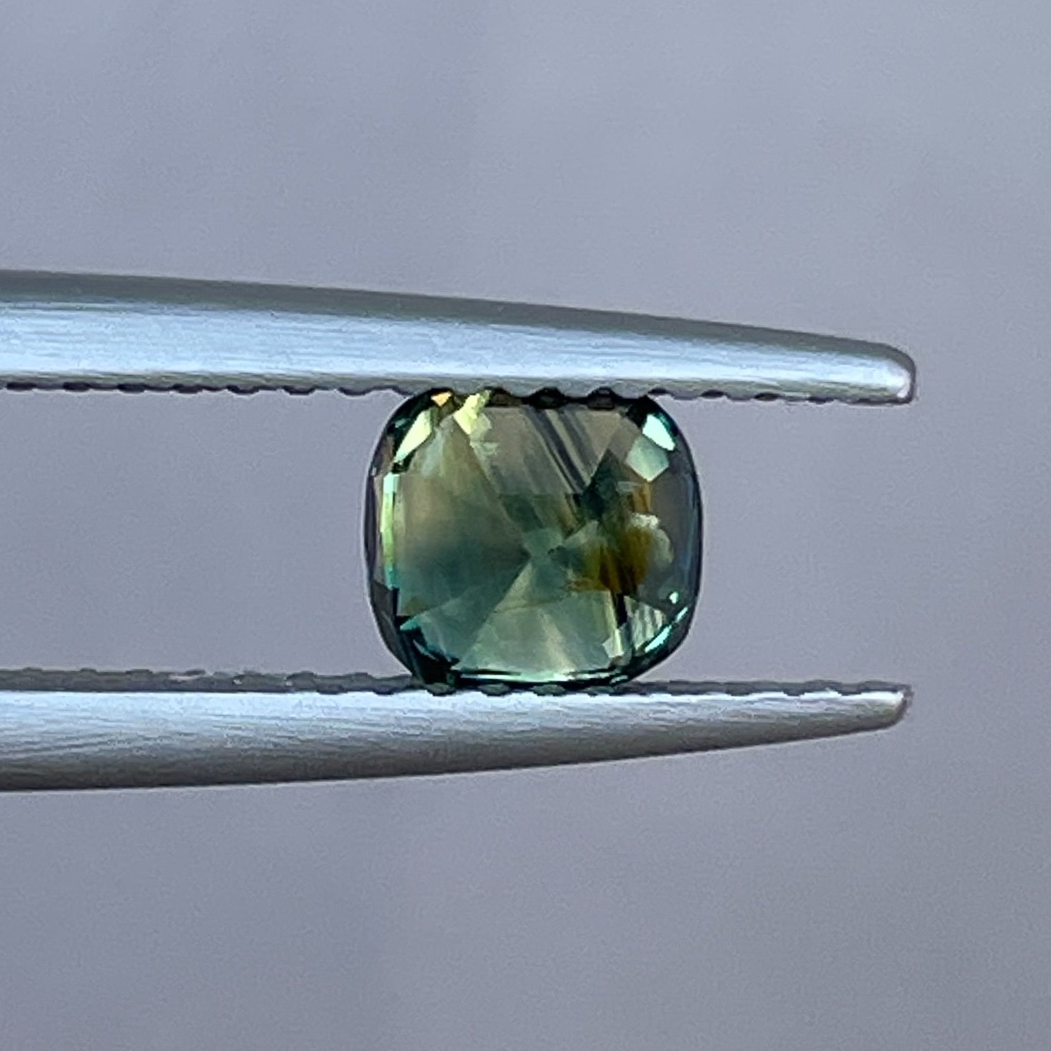Teal Australian Parti Sapphire 1.10 Ct cushion cut loose gemstone by NASHGEMS, perfect for jewelry or engagement rings.