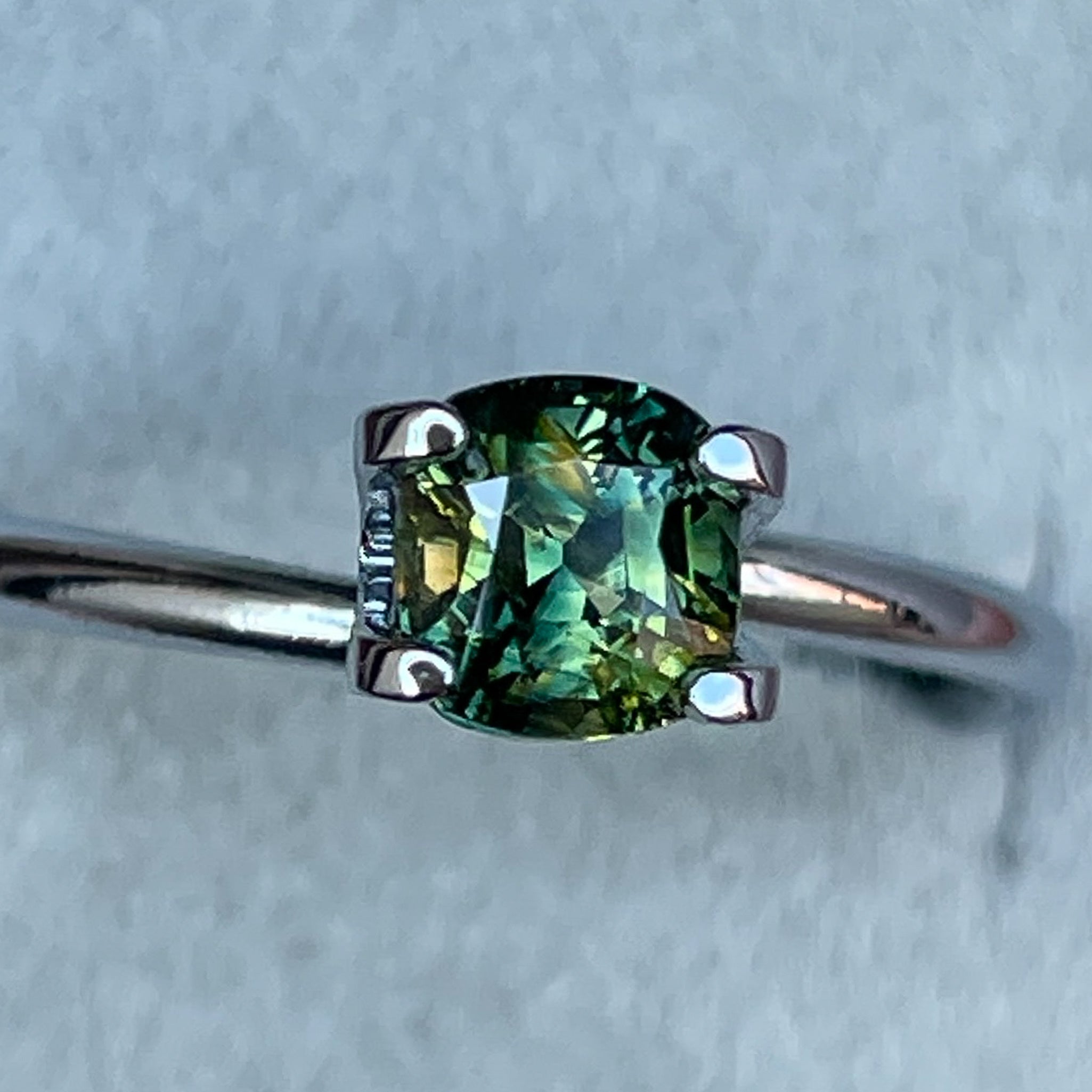 Teal Australian Parti Sapphire 1.10 Ct cushion cut, loose gemstone from NASHGEMS for engagement or custom jewelry.