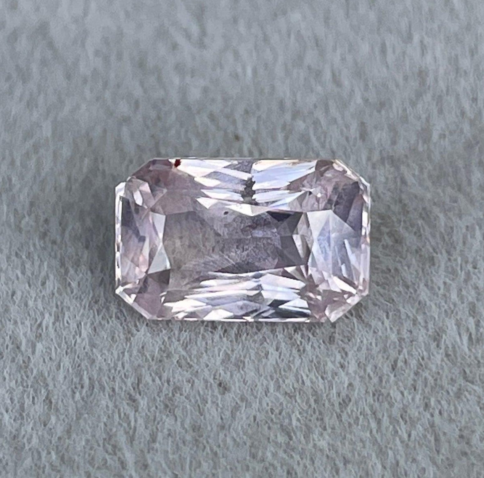 NASHGEMS peach sapphire engagement ring with 2.02 carat oval champagne sapphire set in white gold, perfect for special occasions.