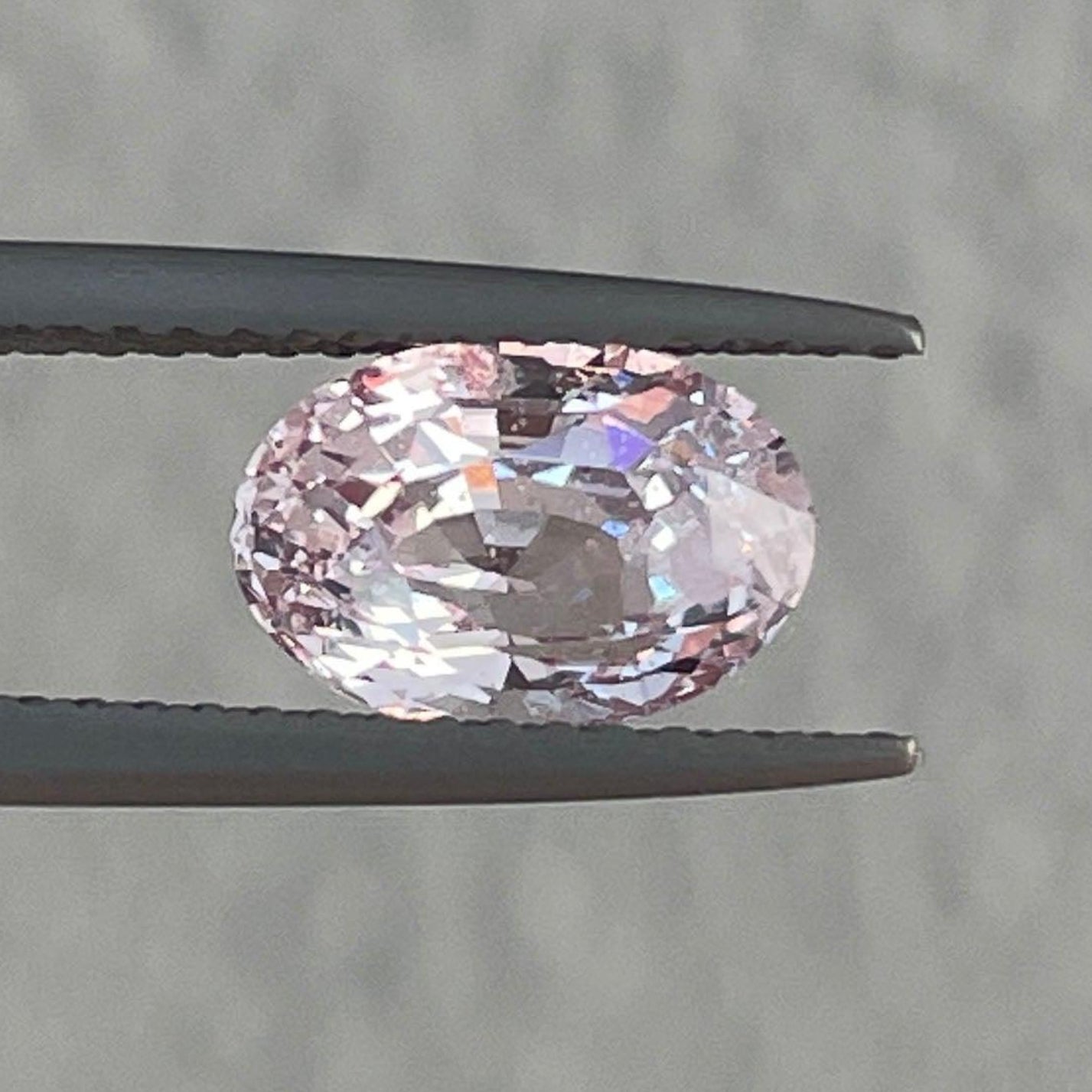 Made to order engagement ring featuring a 2.04 ct peach sapphire gemstone by NASHGEMS, showcasing the custom-designed jewelry.