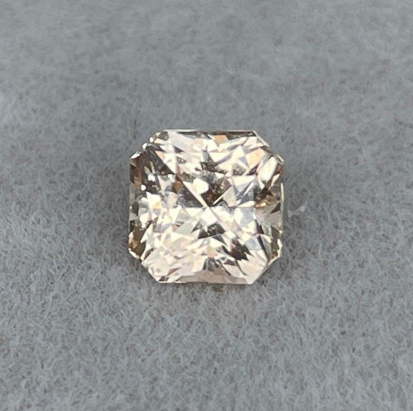 NASHGEMS peach sapphire gemstone, 1.20 ct, natural gemstone pendant showcasing a vibrant peach-colored sapphire.