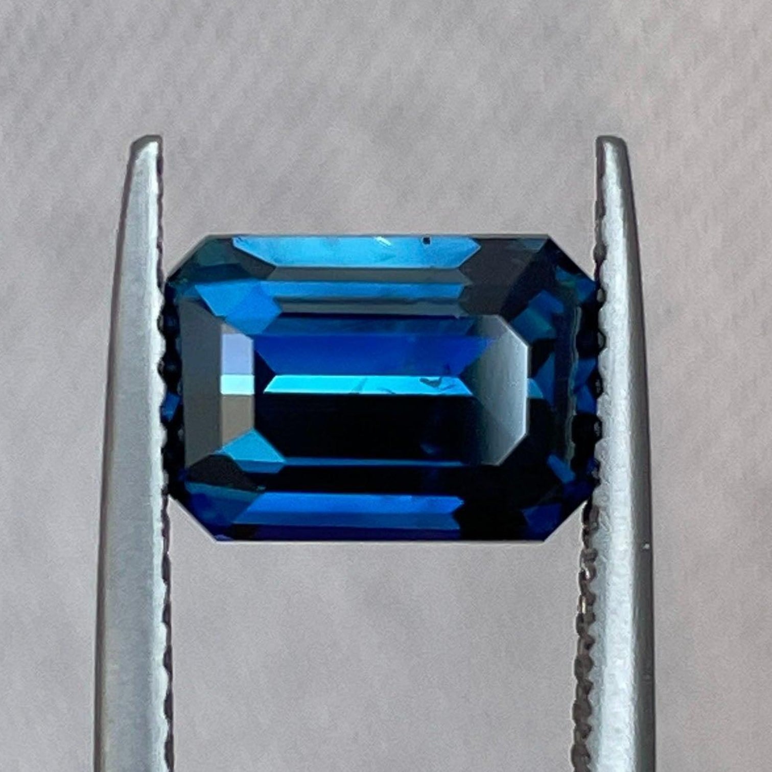 Teal blue and green sapphire emerald cut engagement ring with 3.01 carats, featuring a September birthstone gemstone by NASHGEMS.