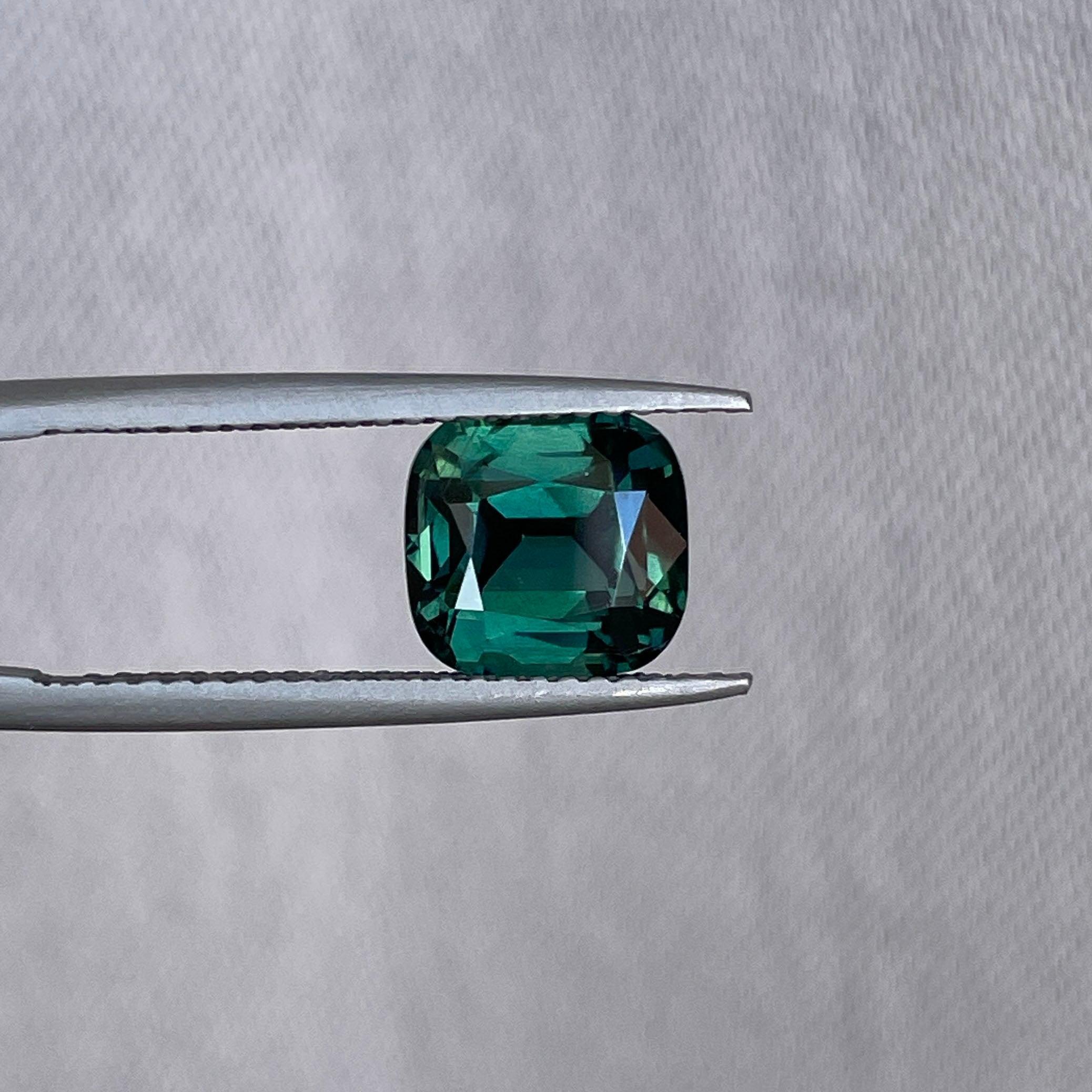 teal blue green parti sapphire cushion cut gem 