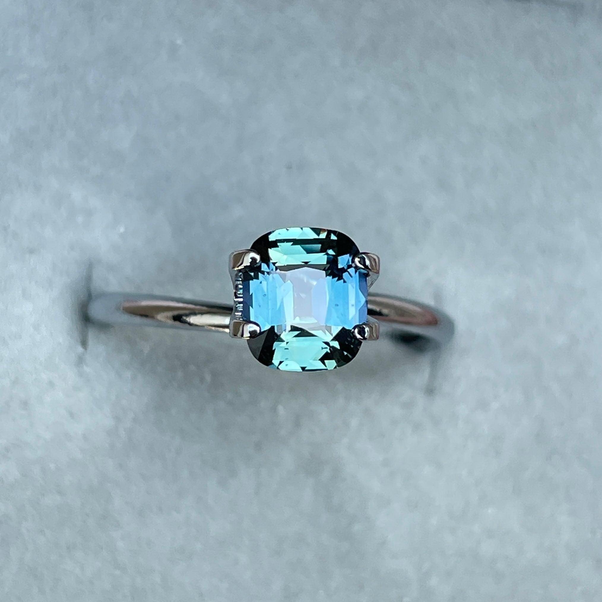 teal blue green parti sapphire cushion cut gem 