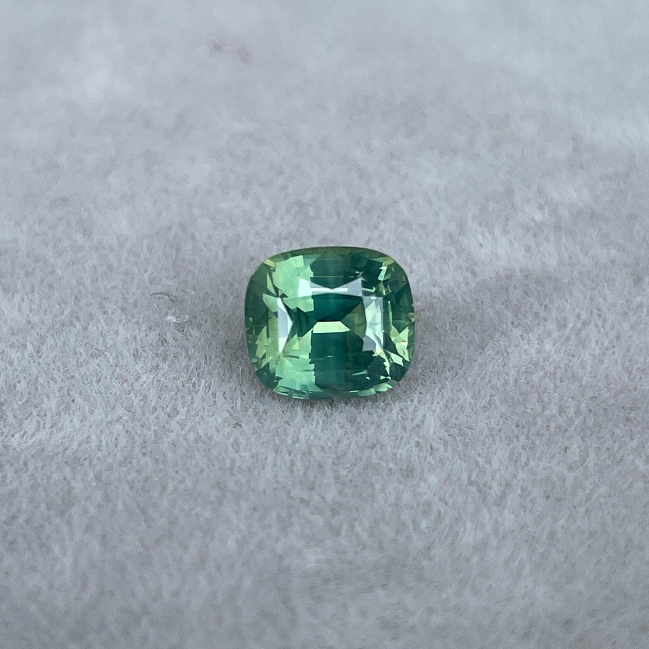 teal blue green parti sapphire cushion cut gem 