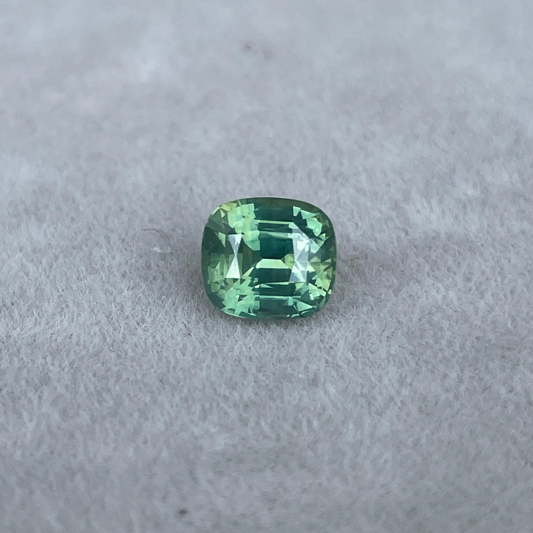 teal blue green parti sapphire cushion cut gem 