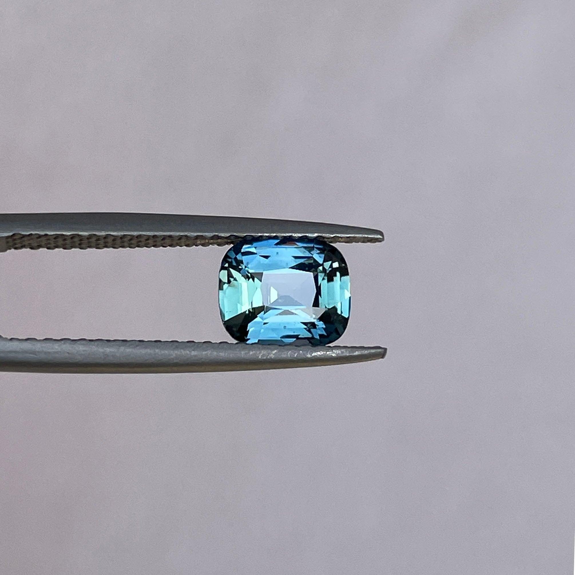 teal blue green parti sapphire cushion cut gem 