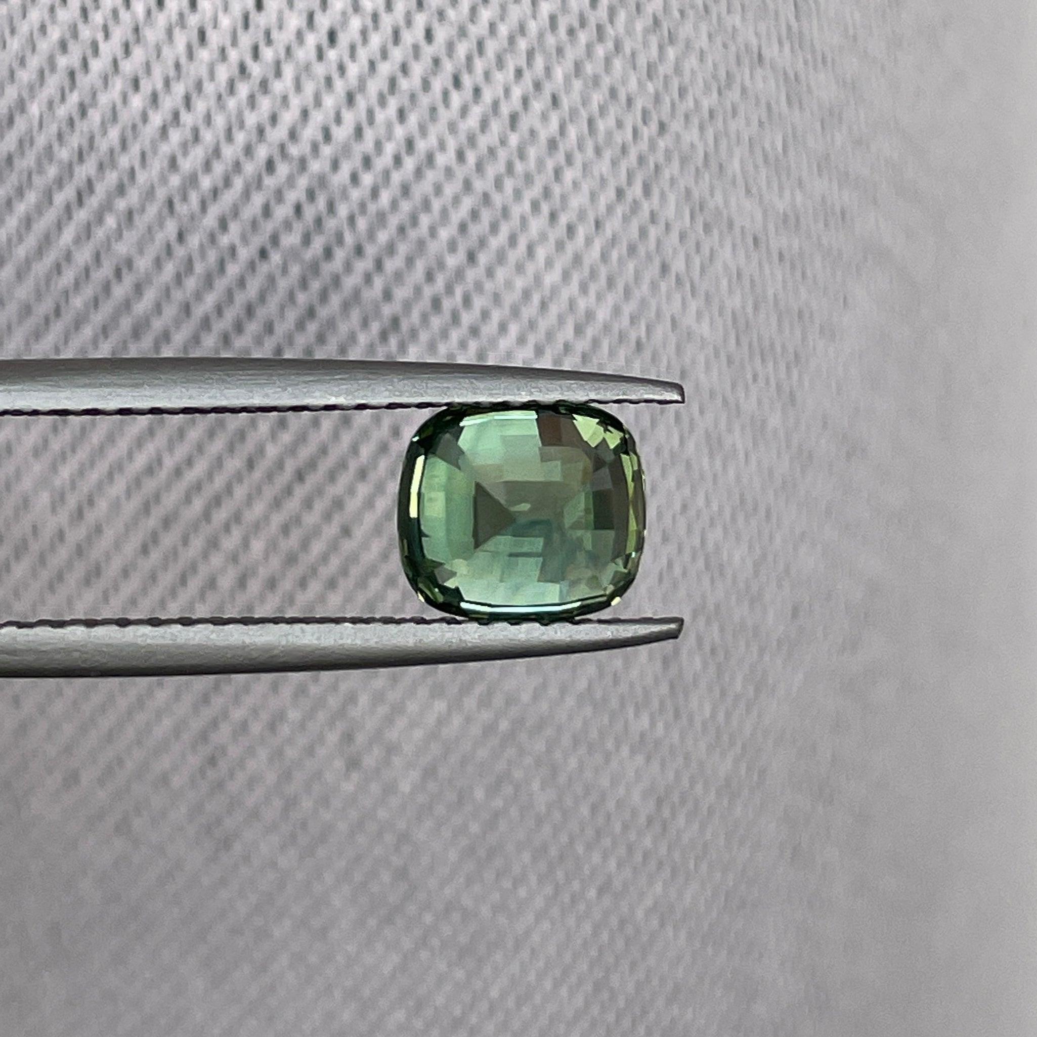 teal blue green parti sapphire cushion cut gem 