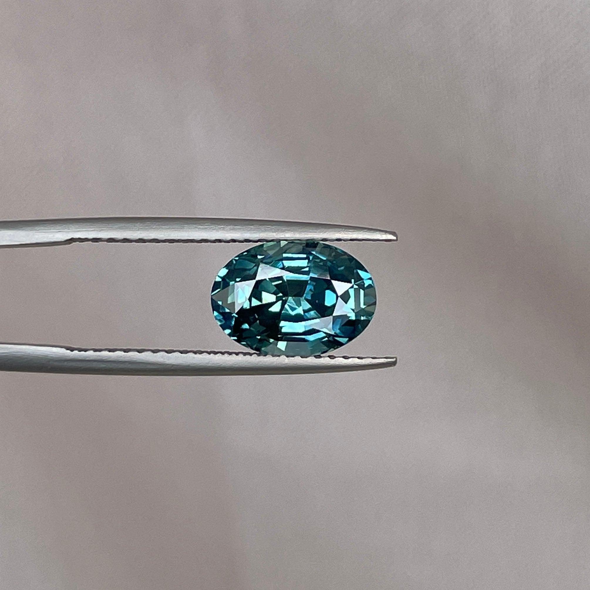 teal blue green parti sapphire oval cut gem 