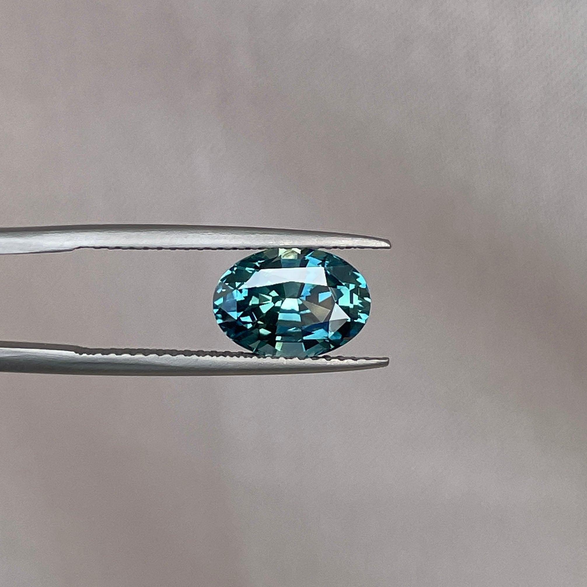 teal blue green parti sapphire oval cut gem 