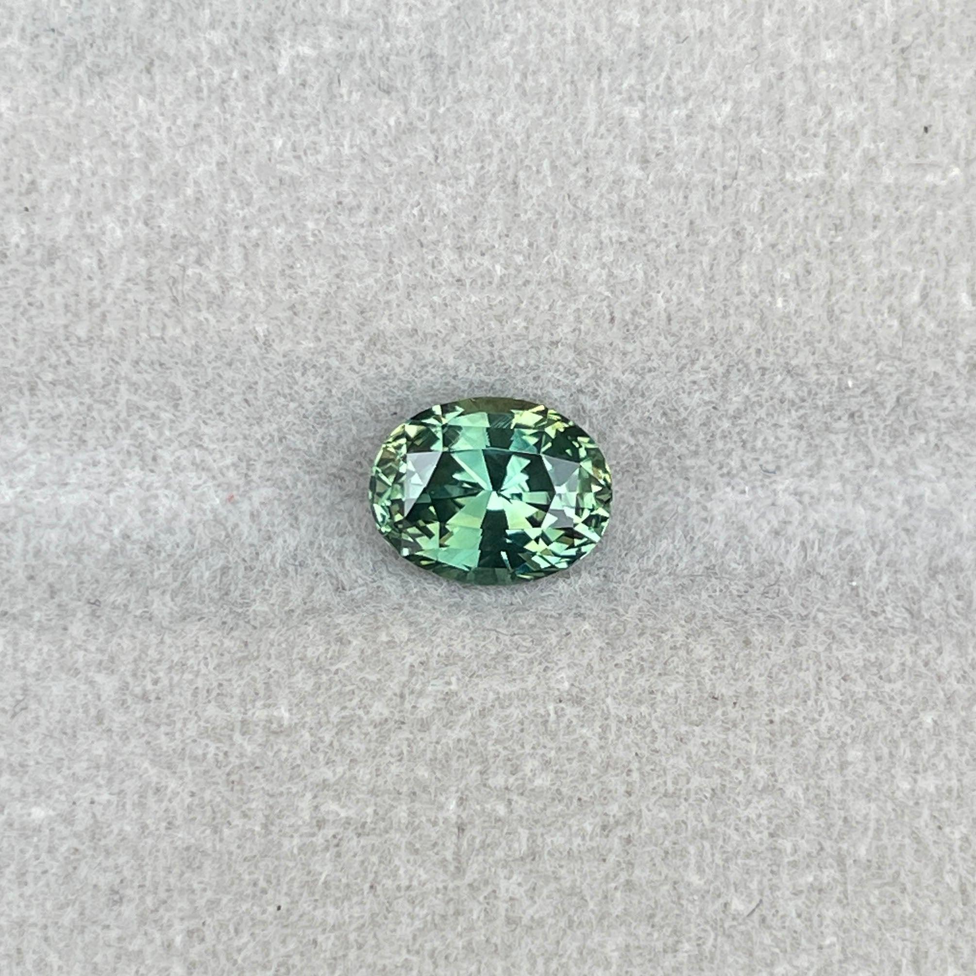 teal blue green parti sapphire oval cut gem 