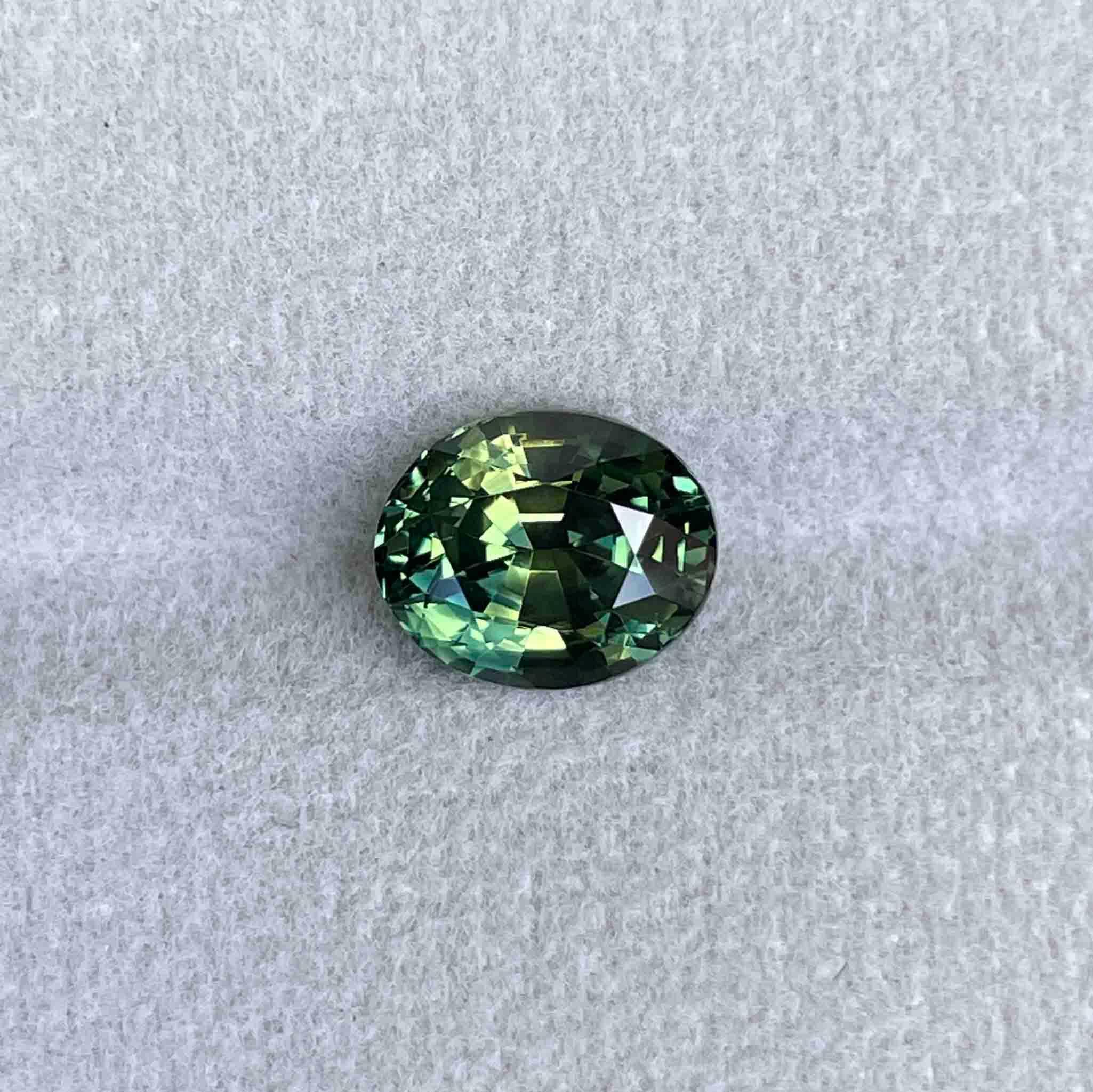 teal blue green parti sapphire oval cut gem 