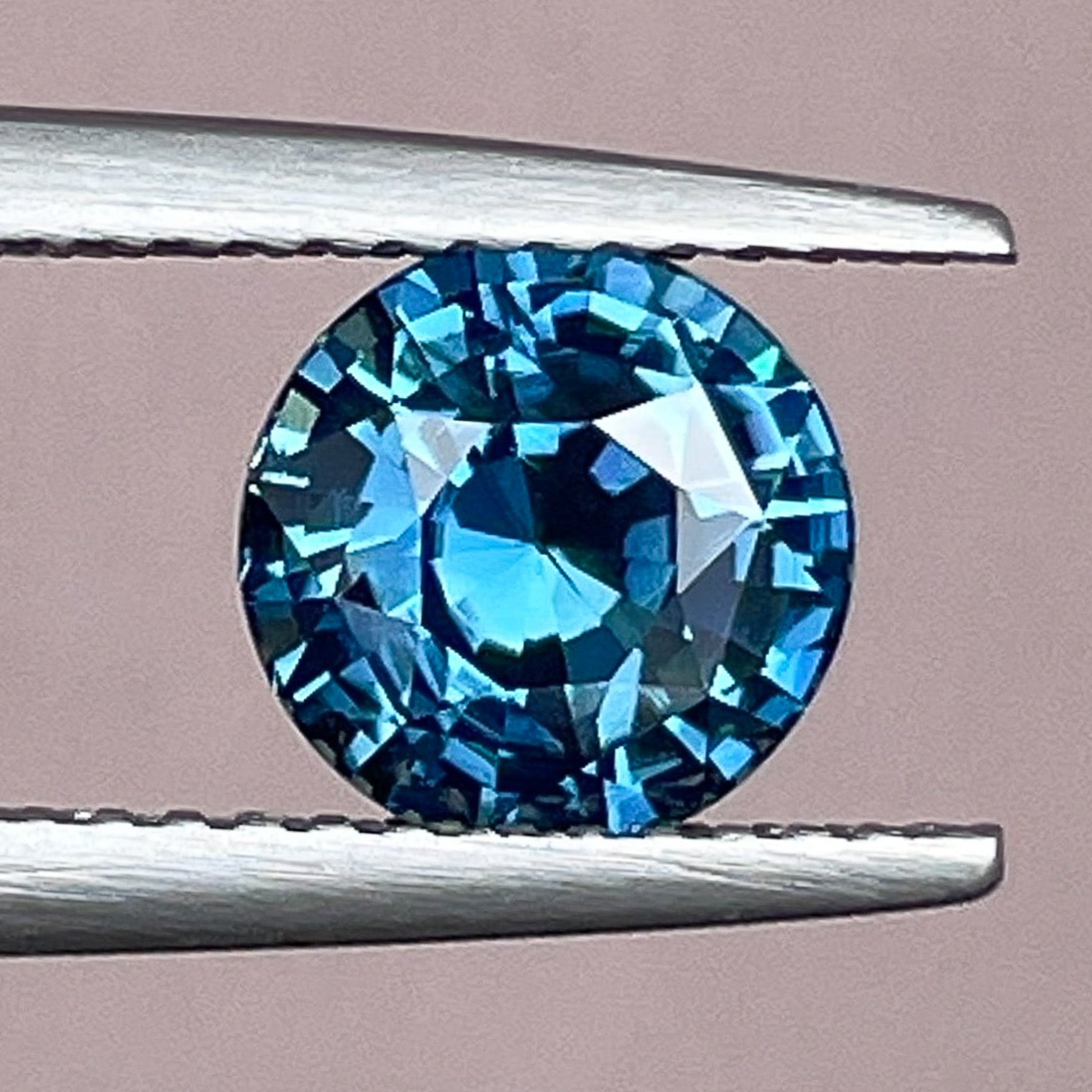 Natural teal blue sapphire, 2.10 ct round cut loose gemstone by NASHGEMS, ideal for engagement rings or custom jewelry.