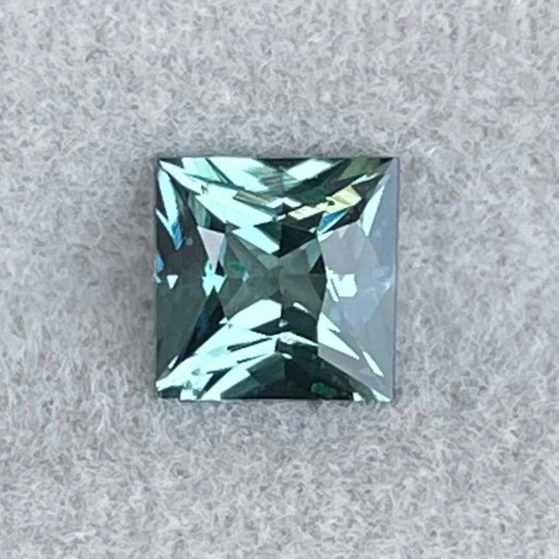 Teal blue green sapphire gemstone, 0.84 Ct, natural loose sapphire for custom engagement or bespoke ring, from NASHGEMS.